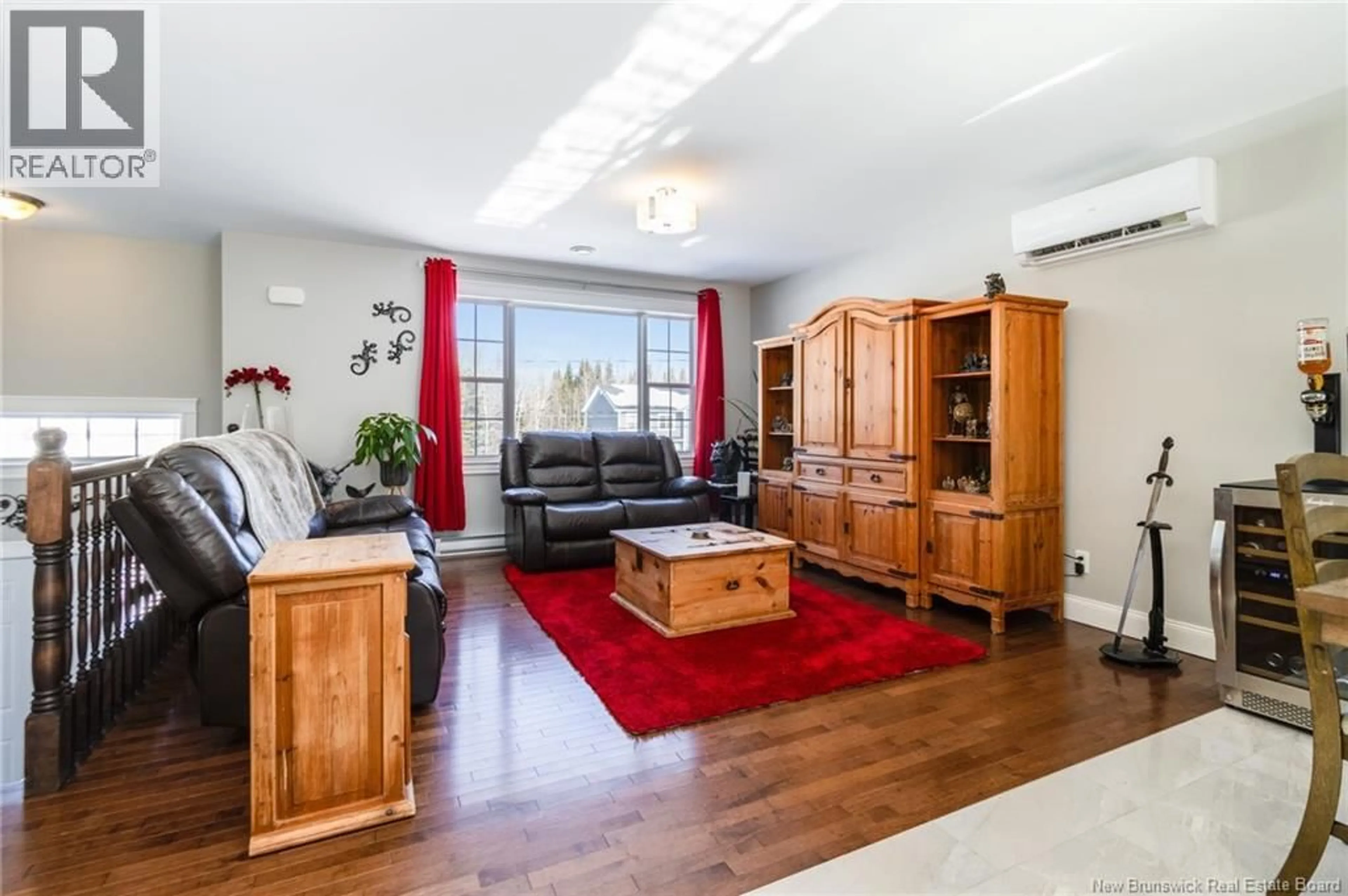 Living room with furniture, wood/laminate floor for 23 BERRY DRIVE, Rusagonis New Brunswick E3B0V9