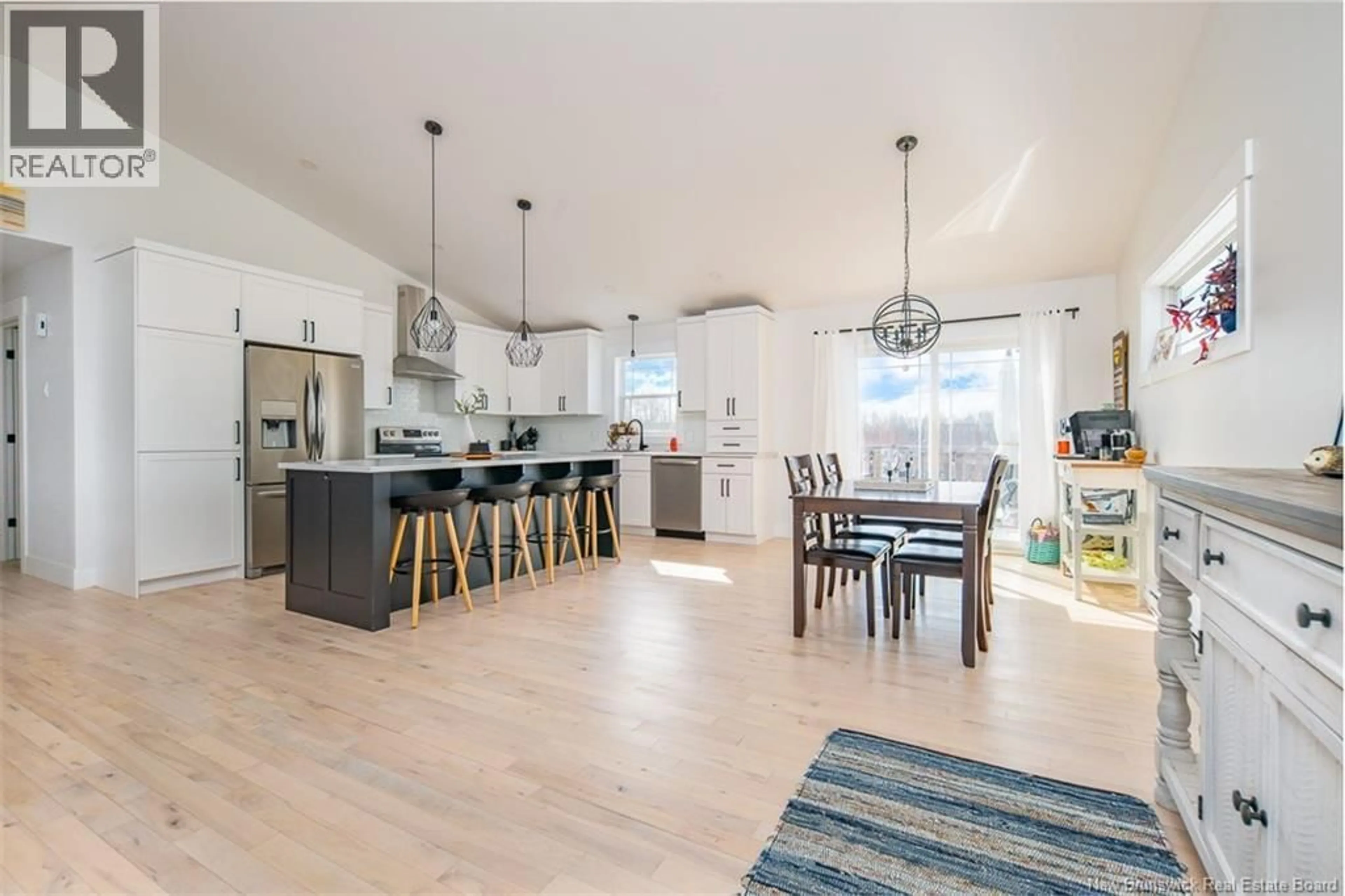 Open concept kitchen, wood/laminate floor for 18 DOHERTY DRIVE, Oromocto New Brunswick E2V0M1