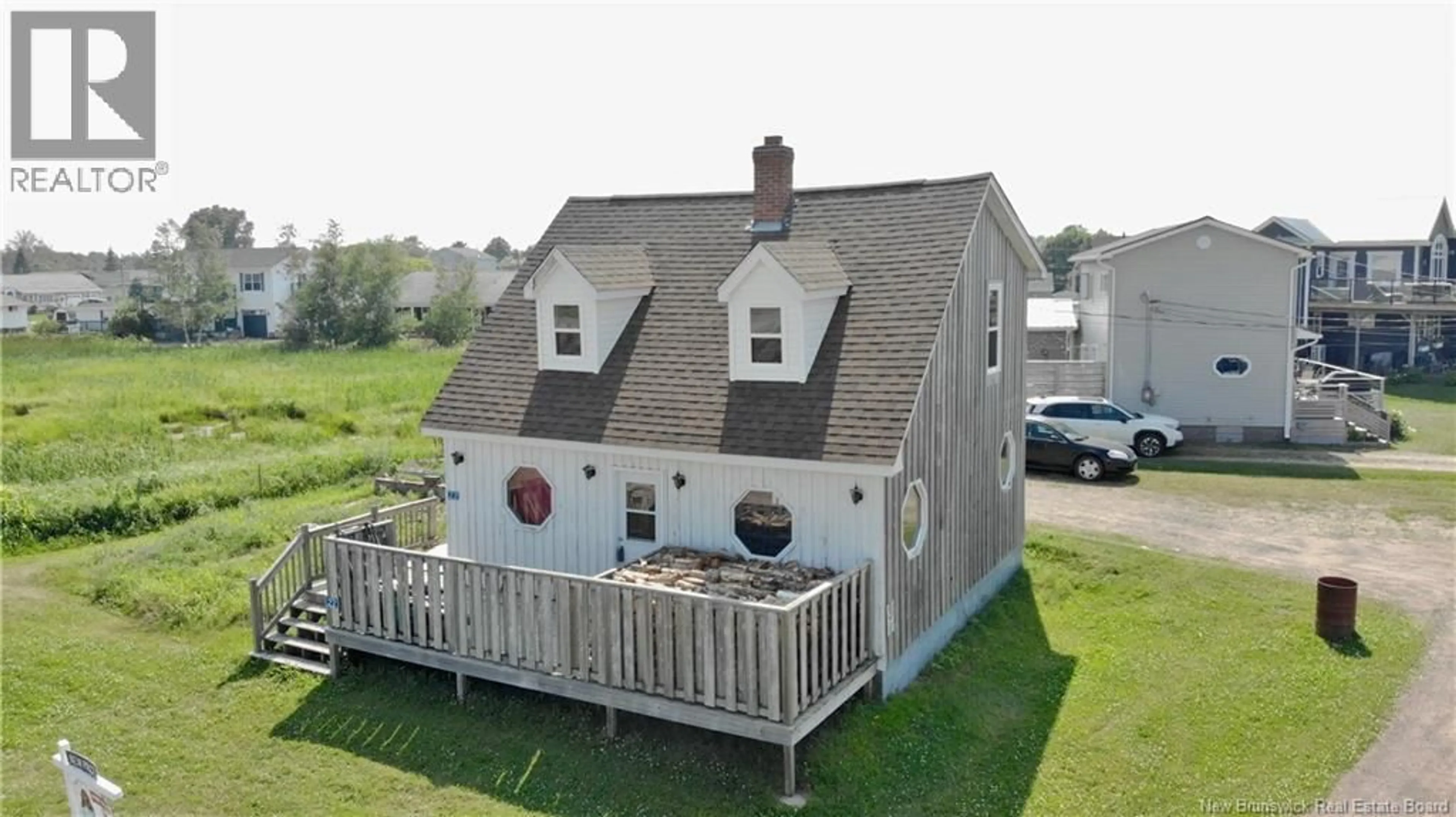 A pic from outside/outdoor area/front of a property/back of a property/a pic from drone, building for 22 BEACH STREET, Pointe-Du-Chêne New Brunswick E4P3V7