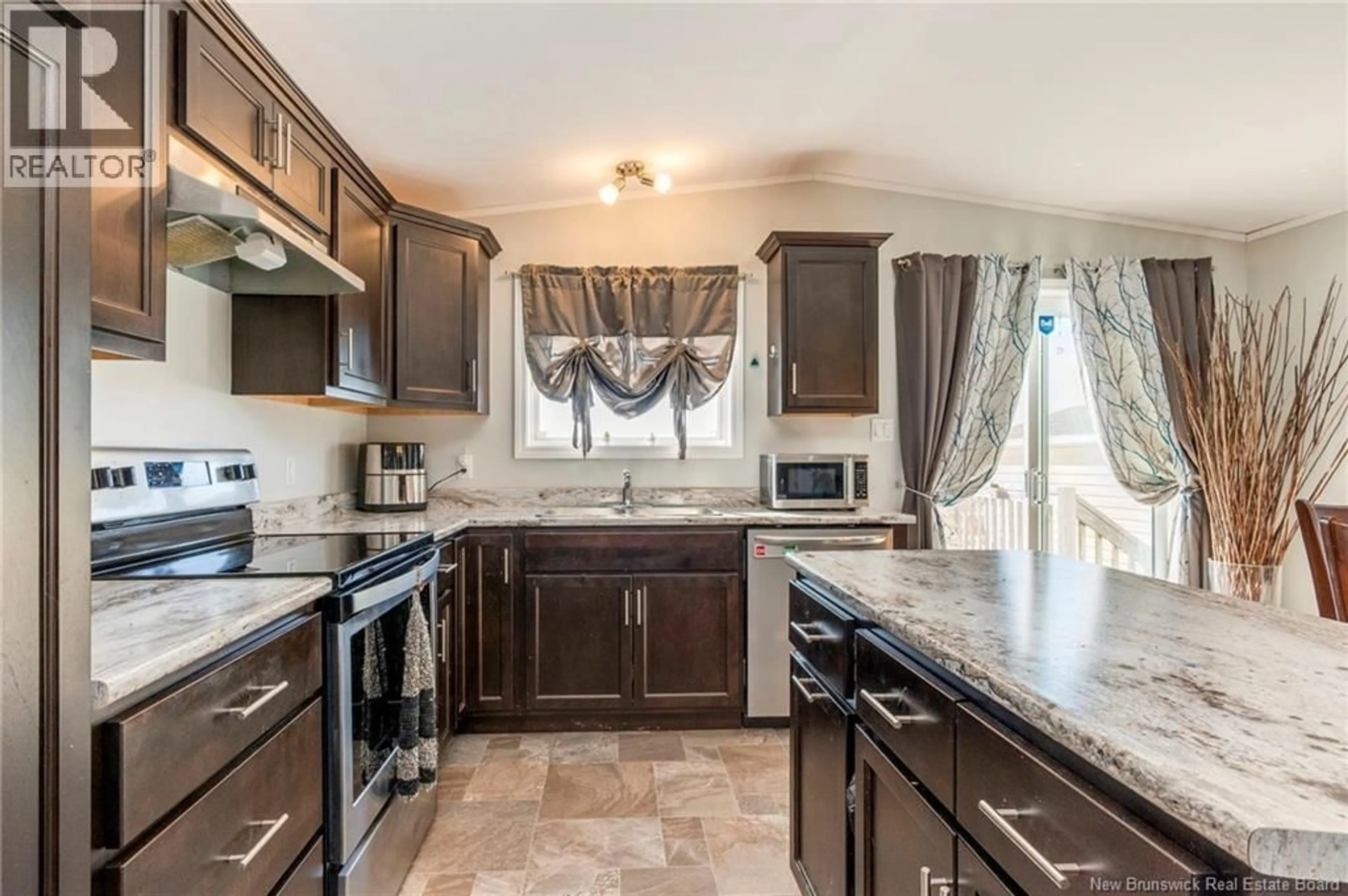 Open concept kitchen, ceramic/tile floor for 14 TELEX LANE, Dieppe New Brunswick E1A8H5