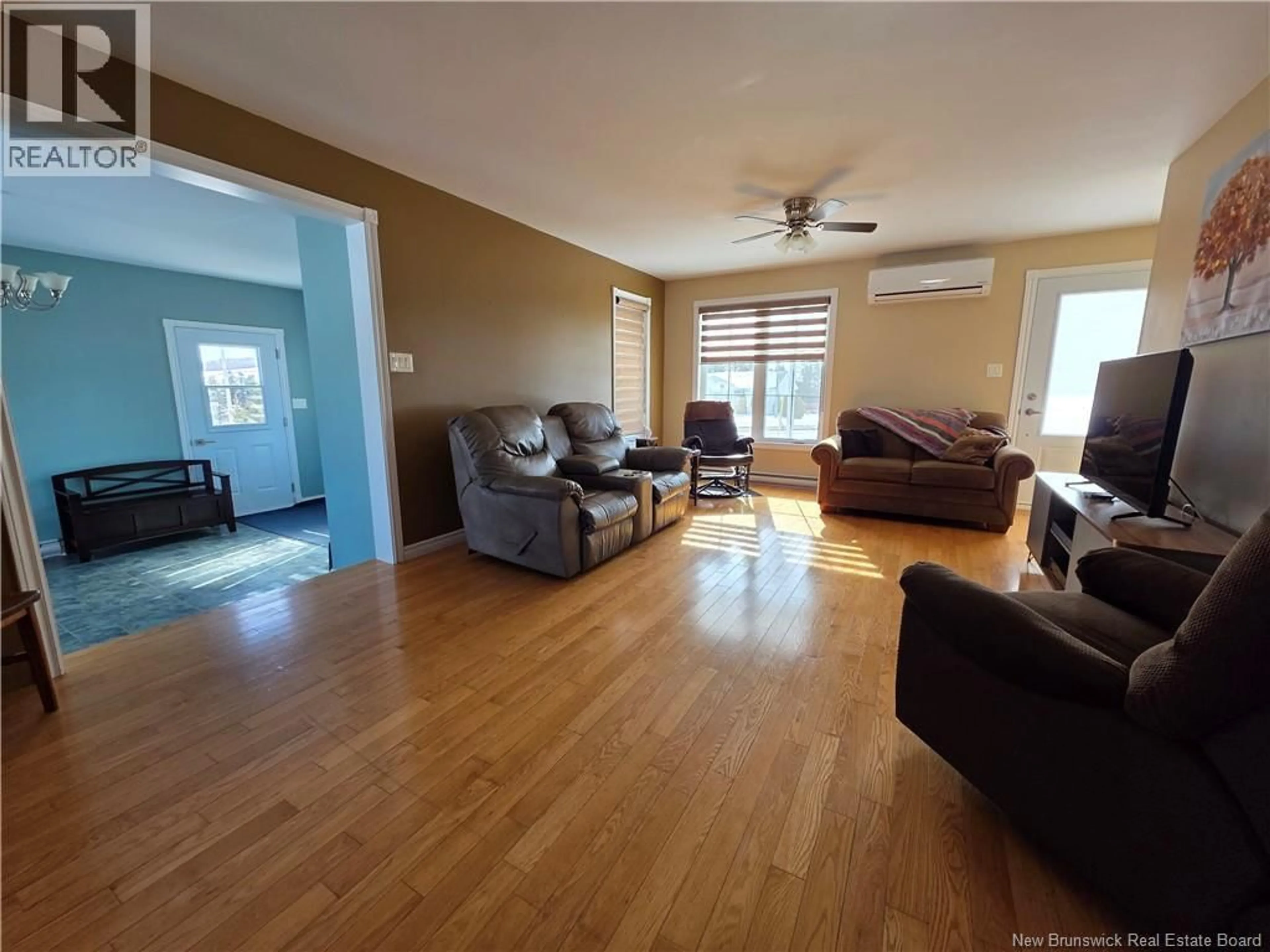 Living room with furniture, wood/laminate floor for 1878 ROUTE 108, DSL de Drummond/DSL of Drummond New Brunswick E3Y2K5