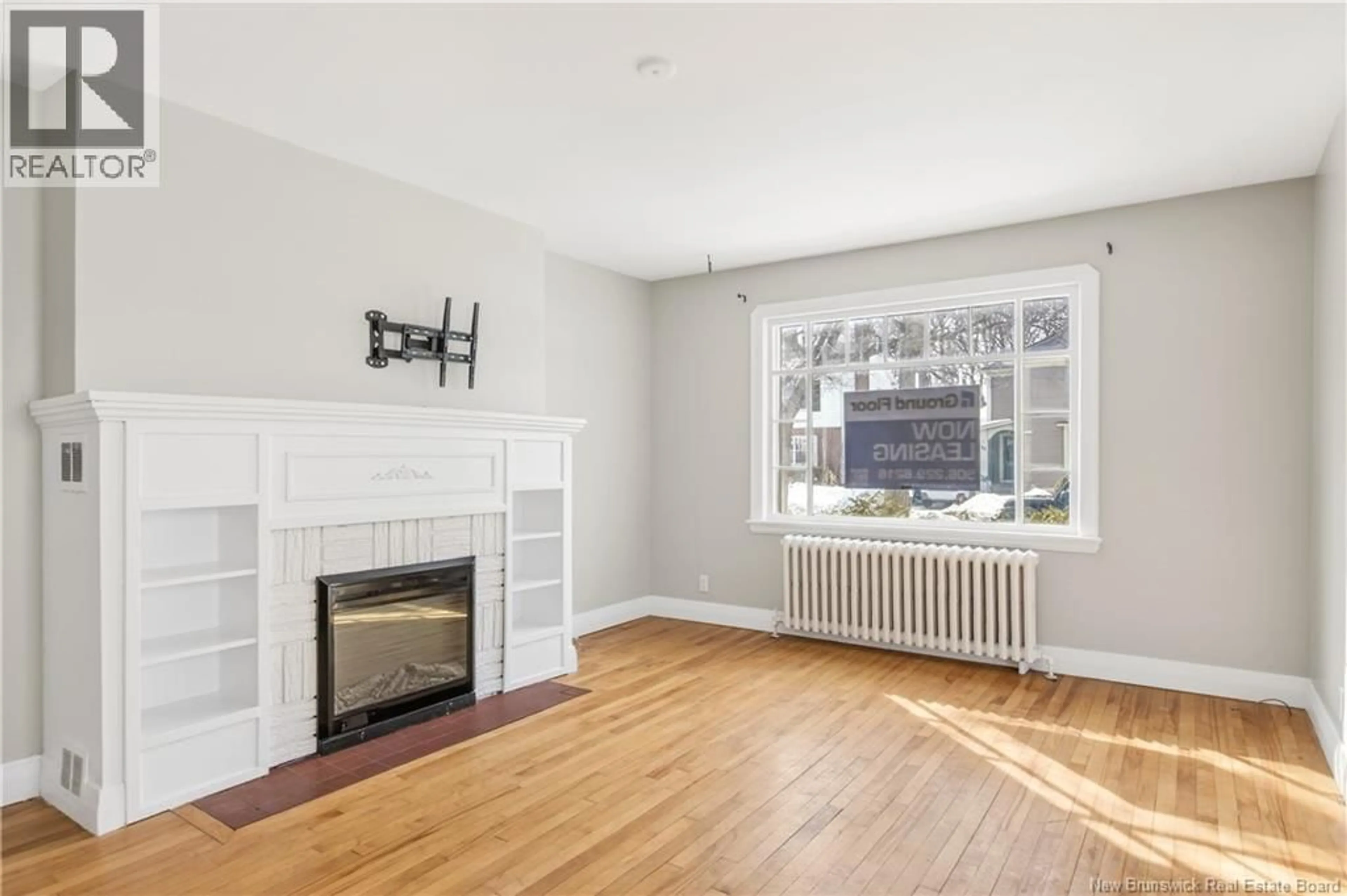 Living room with furniture, wood/laminate floor for 51-53 LAKEWOOD DRIVE, Moncton New Brunswick E1E3L9