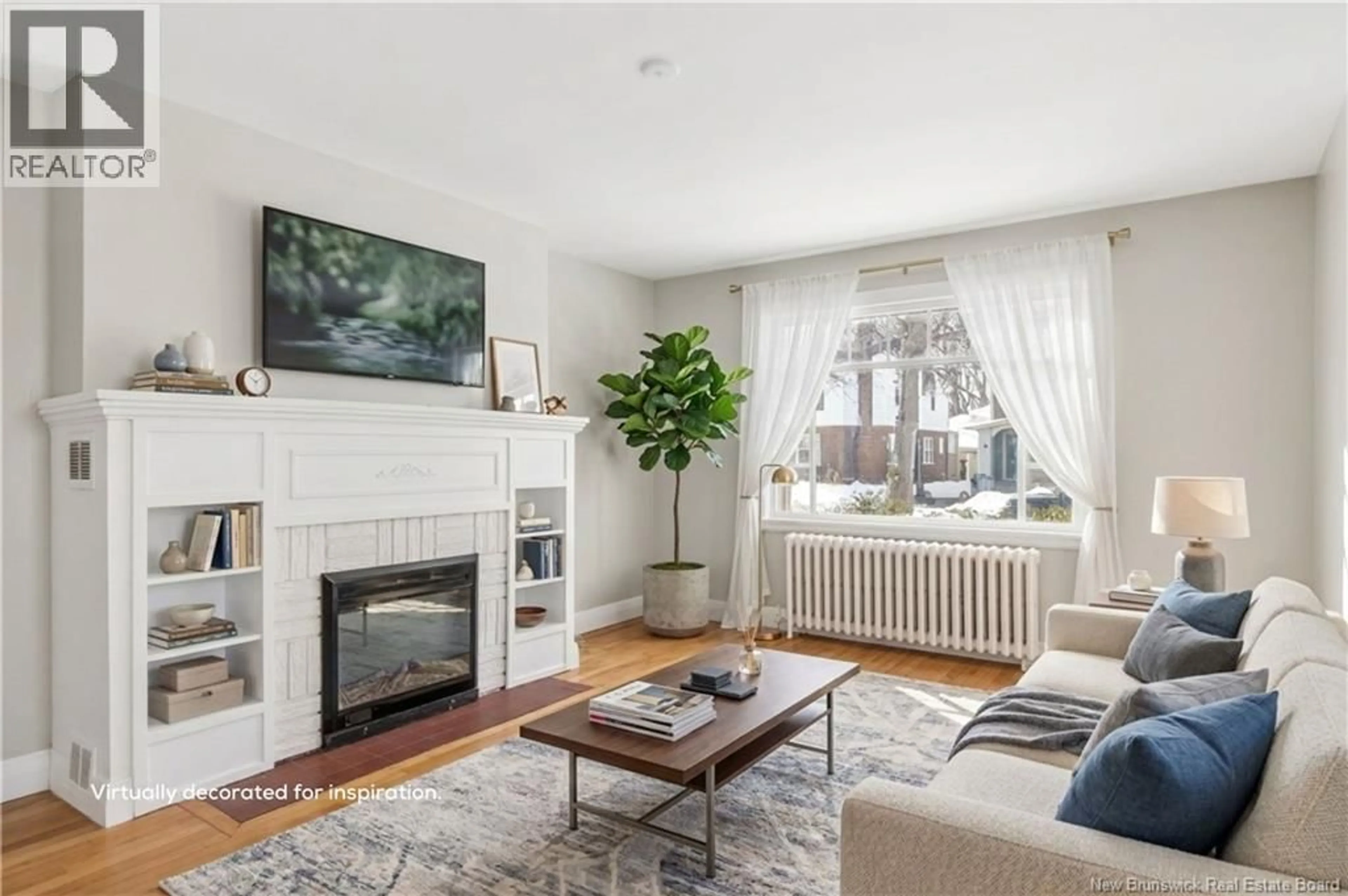 Living room with furniture, wood/laminate floor for 51-53 LAKEWOOD DRIVE, Moncton New Brunswick E1E3L9