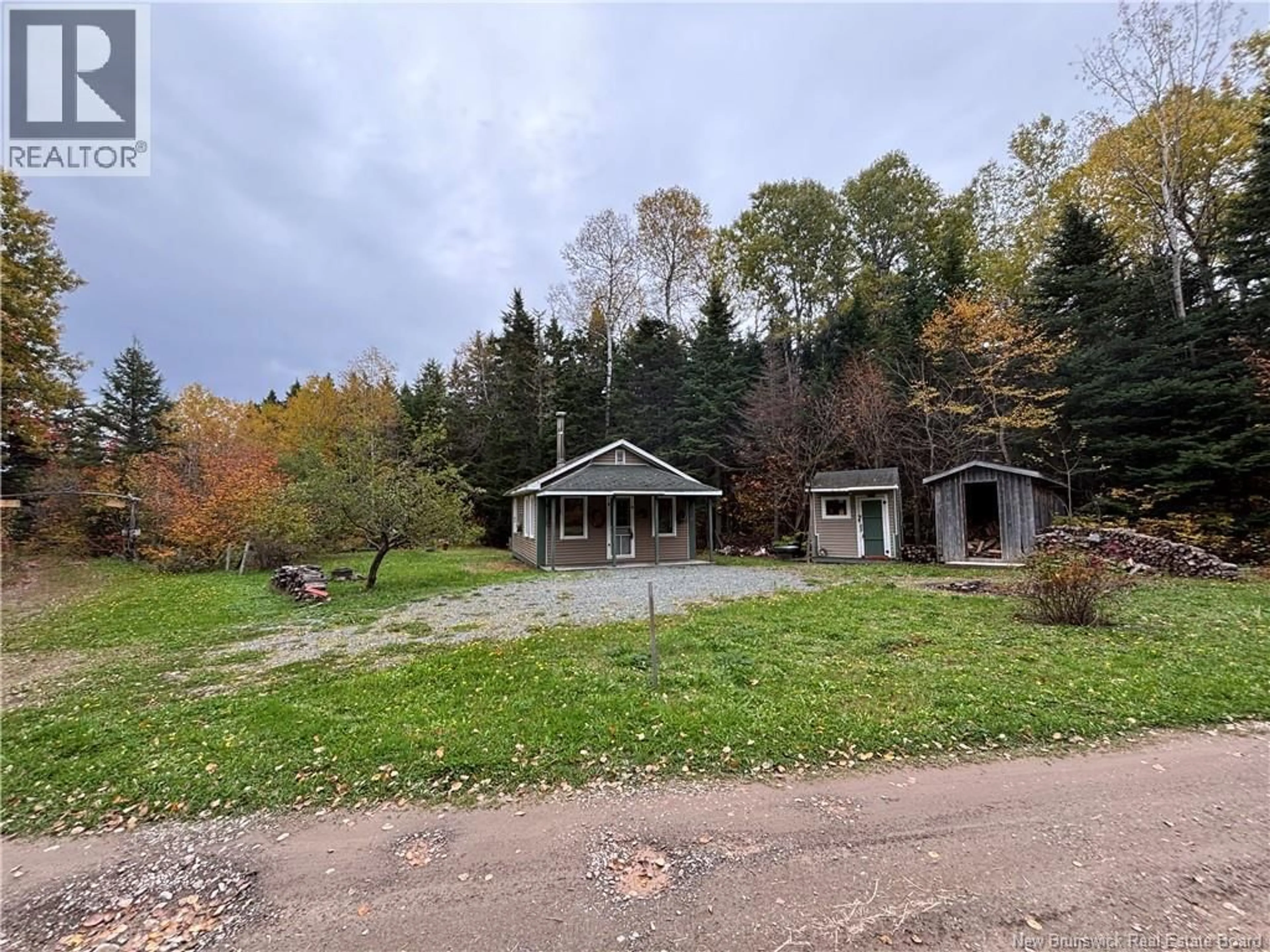 A pic from outside/outdoor area/front of a property/back of a property/a pic from drone, forest/trees view for 560 CD RUE PRINCIPALE, Beresford New Brunswick E8K2A8
