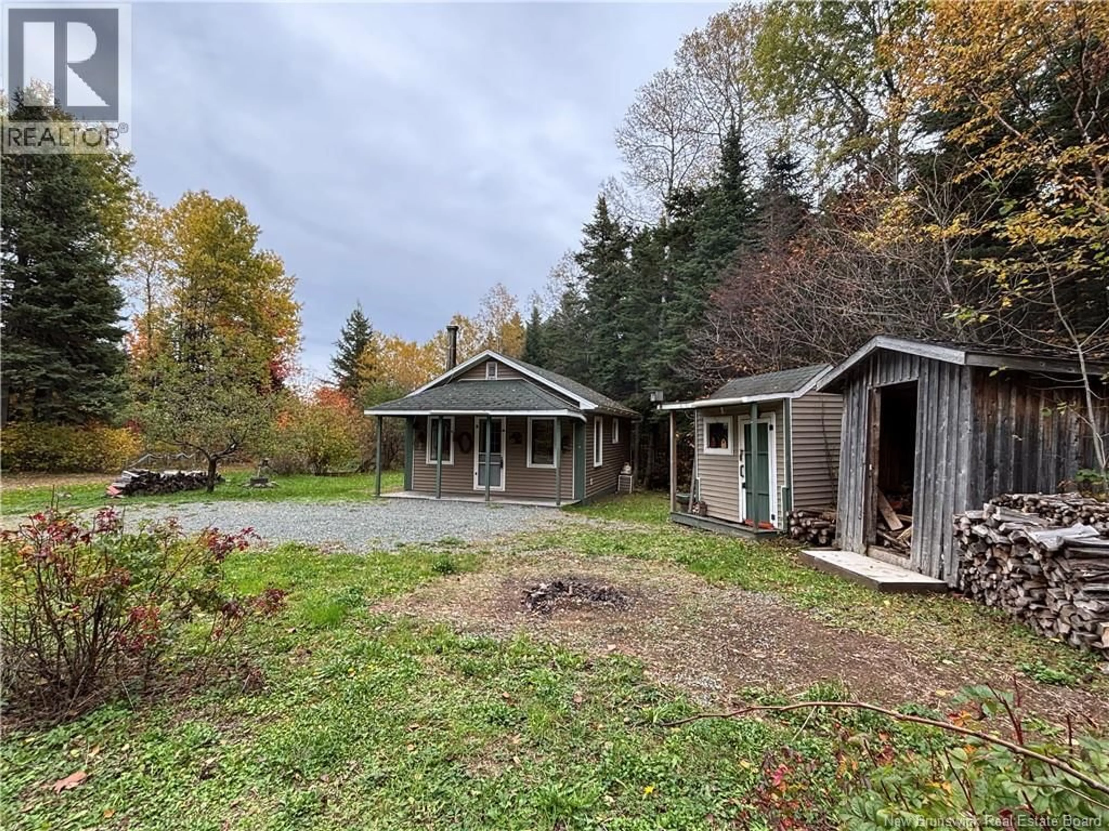 A pic from outside/outdoor area/front of a property/back of a property/a pic from drone, forest/trees view for 560 CD RUE PRINCIPALE, Beresford New Brunswick E8K2A8