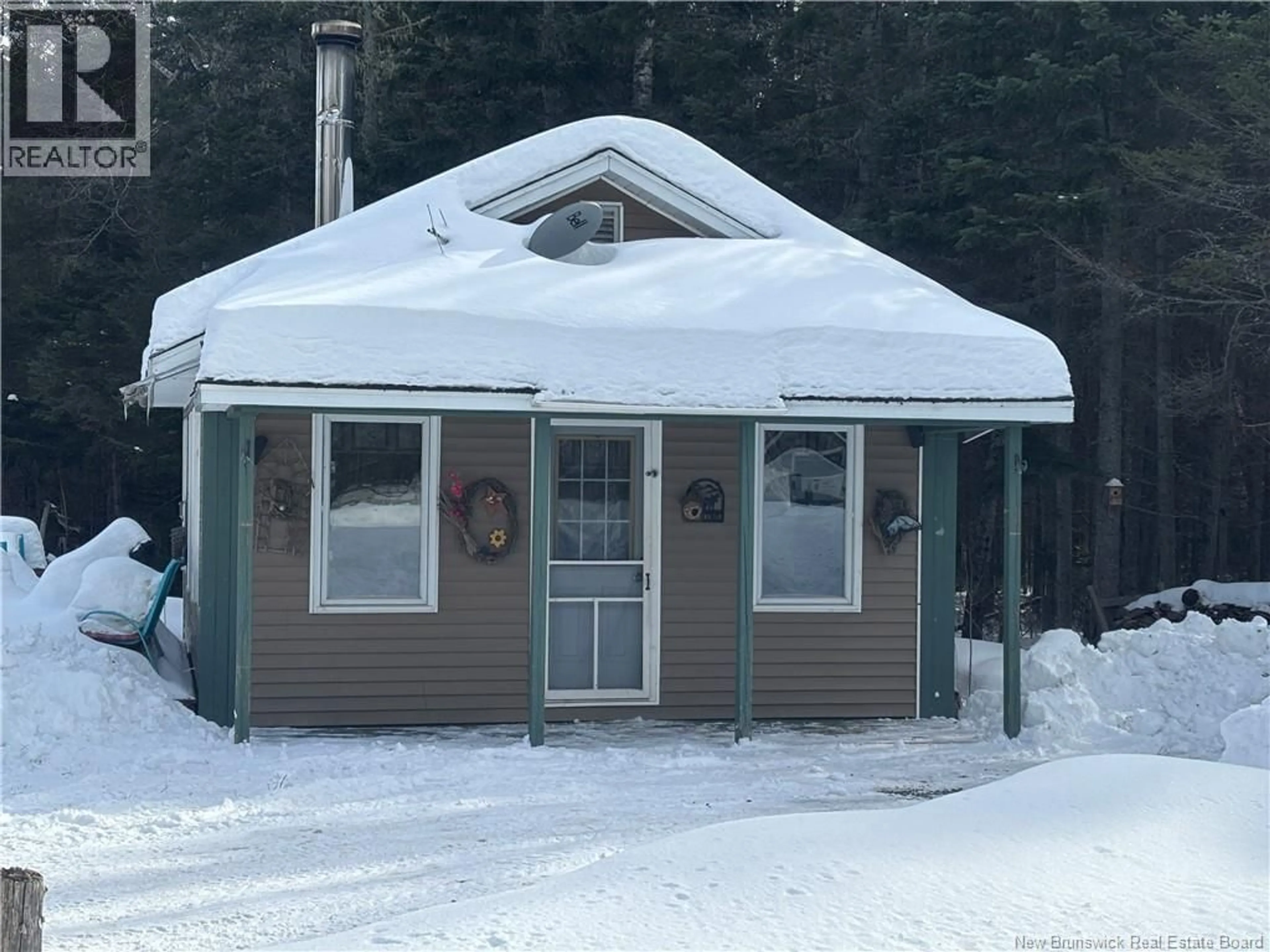 Home with vinyl exterior material, street for 560 CD RUE PRINCIPALE, Beresford New Brunswick E8K2A8