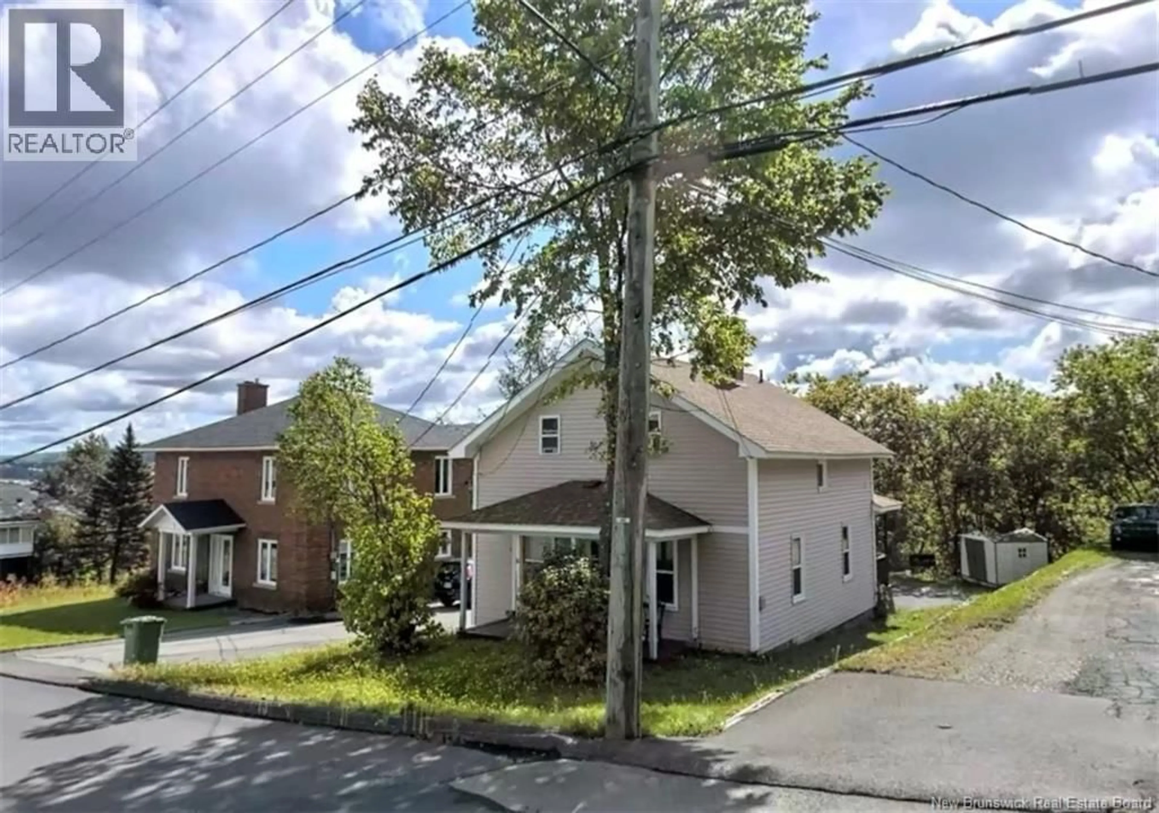 A pic from outside/outdoor area/front of a property/back of a property/a pic from drone, street for 16 RUE BELLEVUE STREET, Edmundston New Brunswick E3V2C7