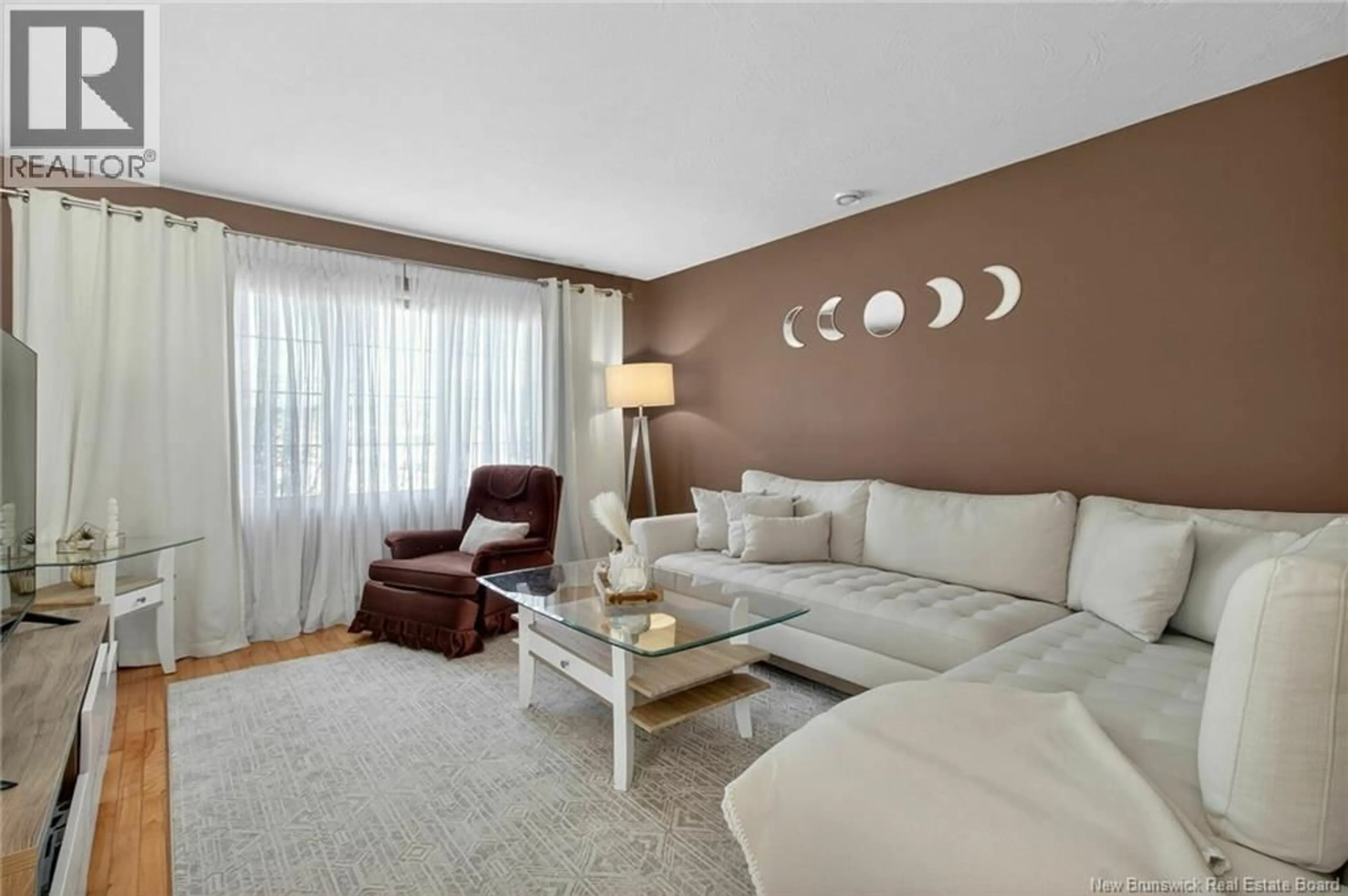 Living room with furniture, wood/laminate floor for 645 MELANSON ROAD, Dieppe New Brunswick E1A1A5