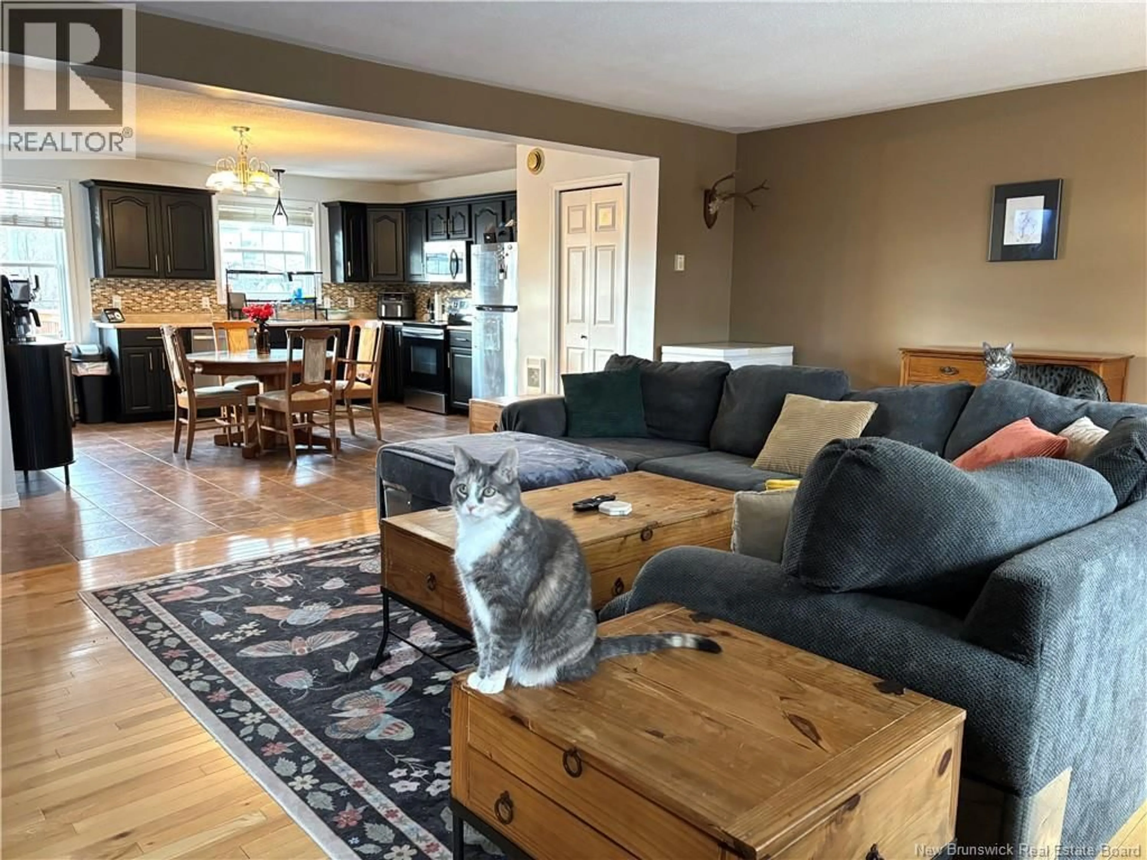 Living room with furniture, wood/laminate floor for 723 BROOKSIDE DRIVE, Fredericton New Brunswick E3G8T9