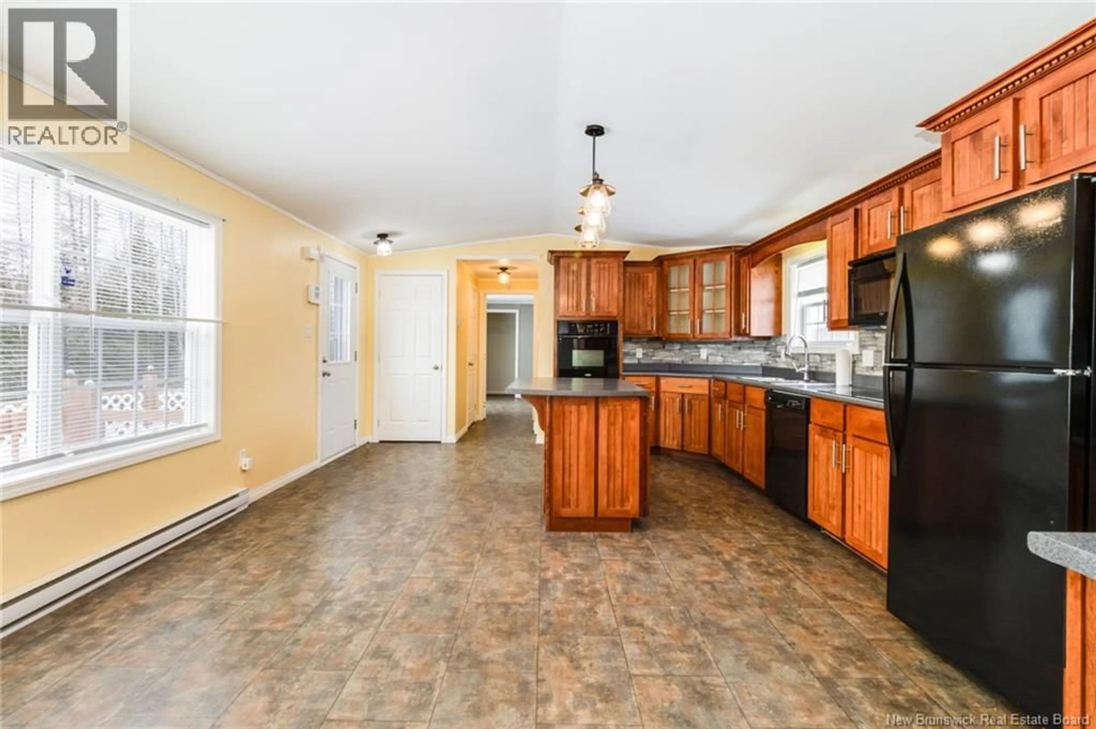 Open concept kitchen, ceramic/tile floor for 23 O'LEARY CRESCENT, Rusagonis New Brunswick E3B0R3
