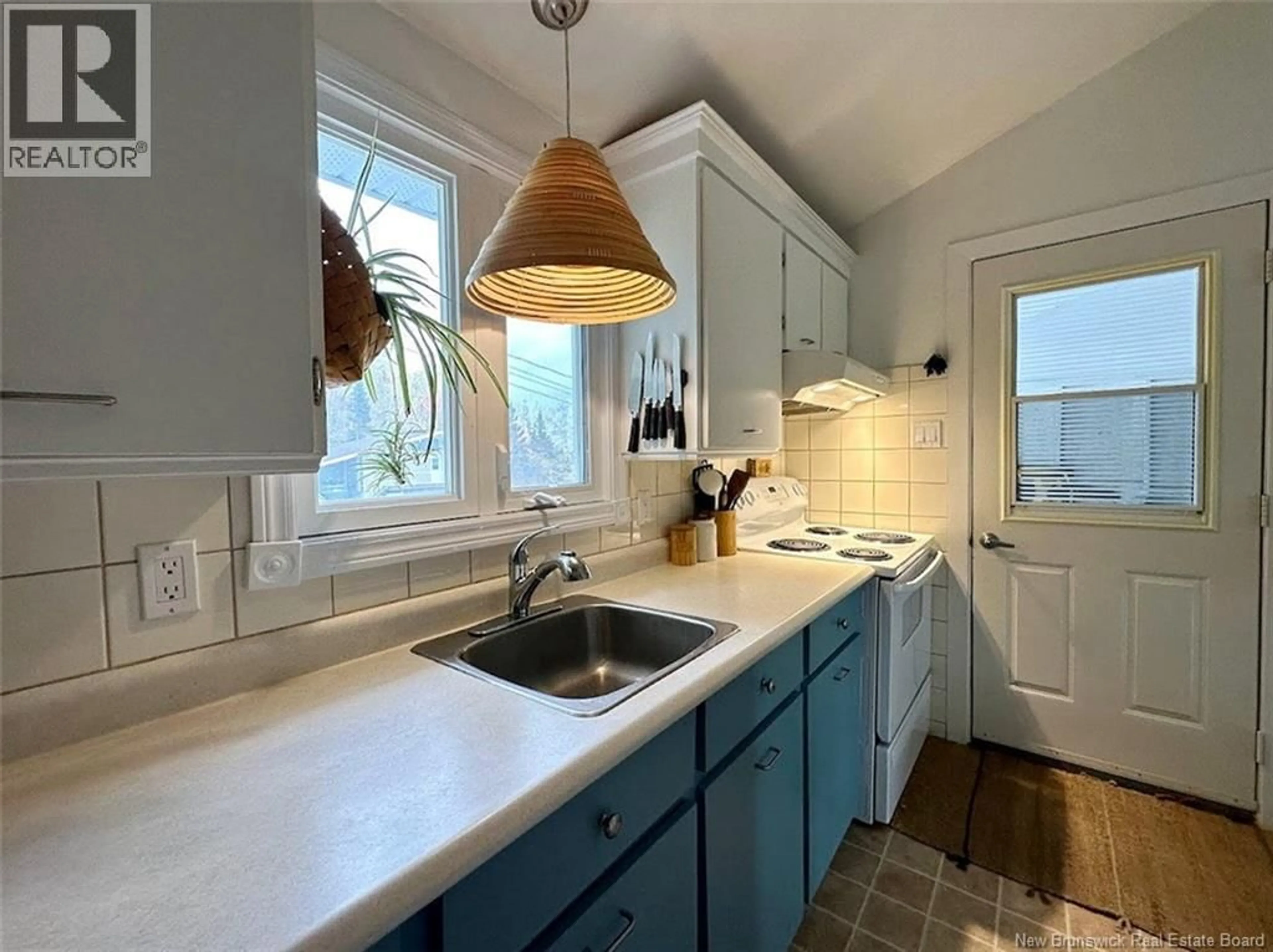 Open concept kitchen, ceramic/tile floor for 102 J-GASPARD-BOUCHER AVENUE, Edmundston New Brunswick E3V1P9