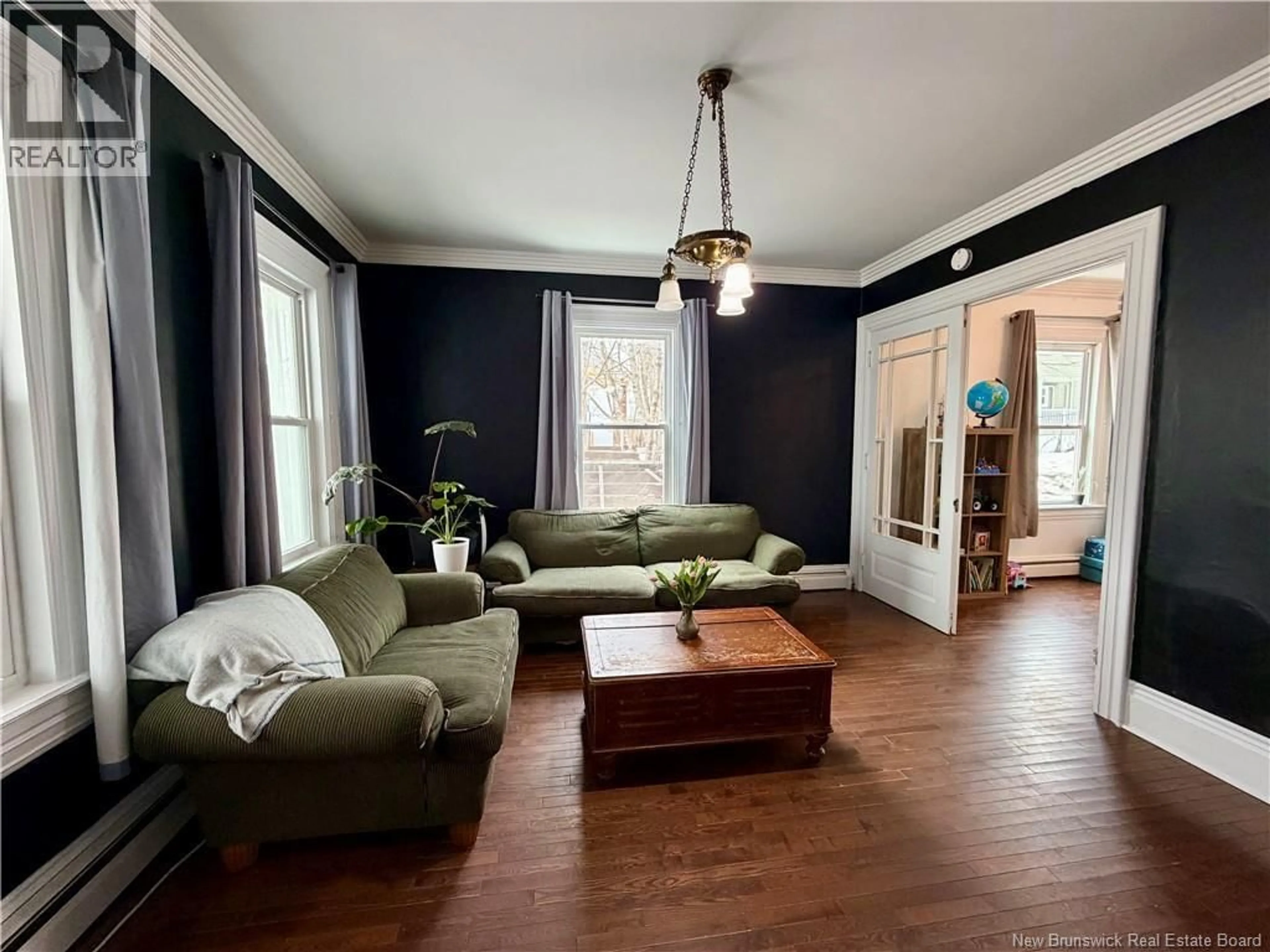 Living room with furniture, wood/laminate floor for 126 BROADWAY STREET, Woodstock New Brunswick E7M1C2