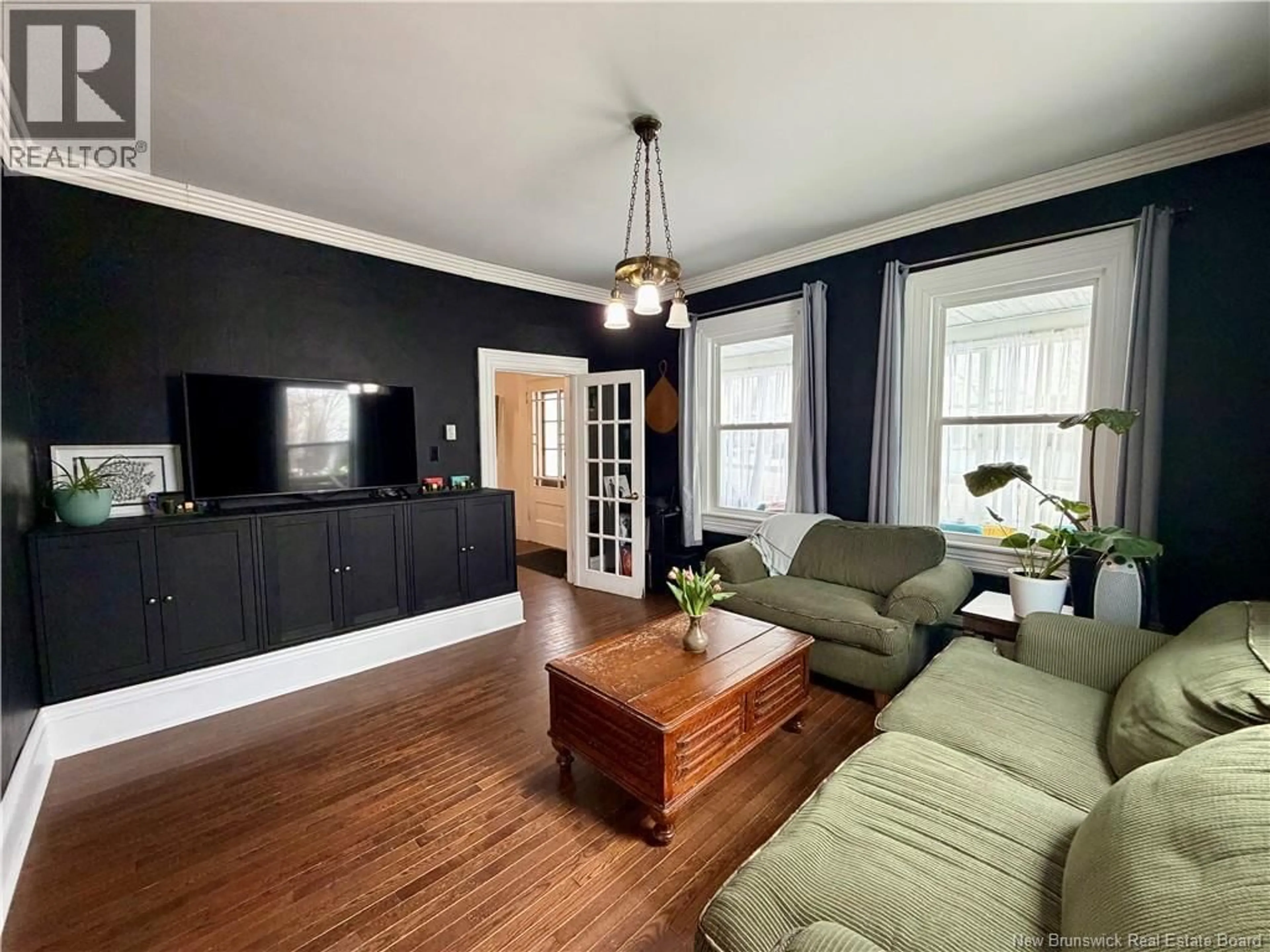 Living room with furniture, wood/laminate floor for 126 BROADWAY STREET, Woodstock New Brunswick E7M1C2