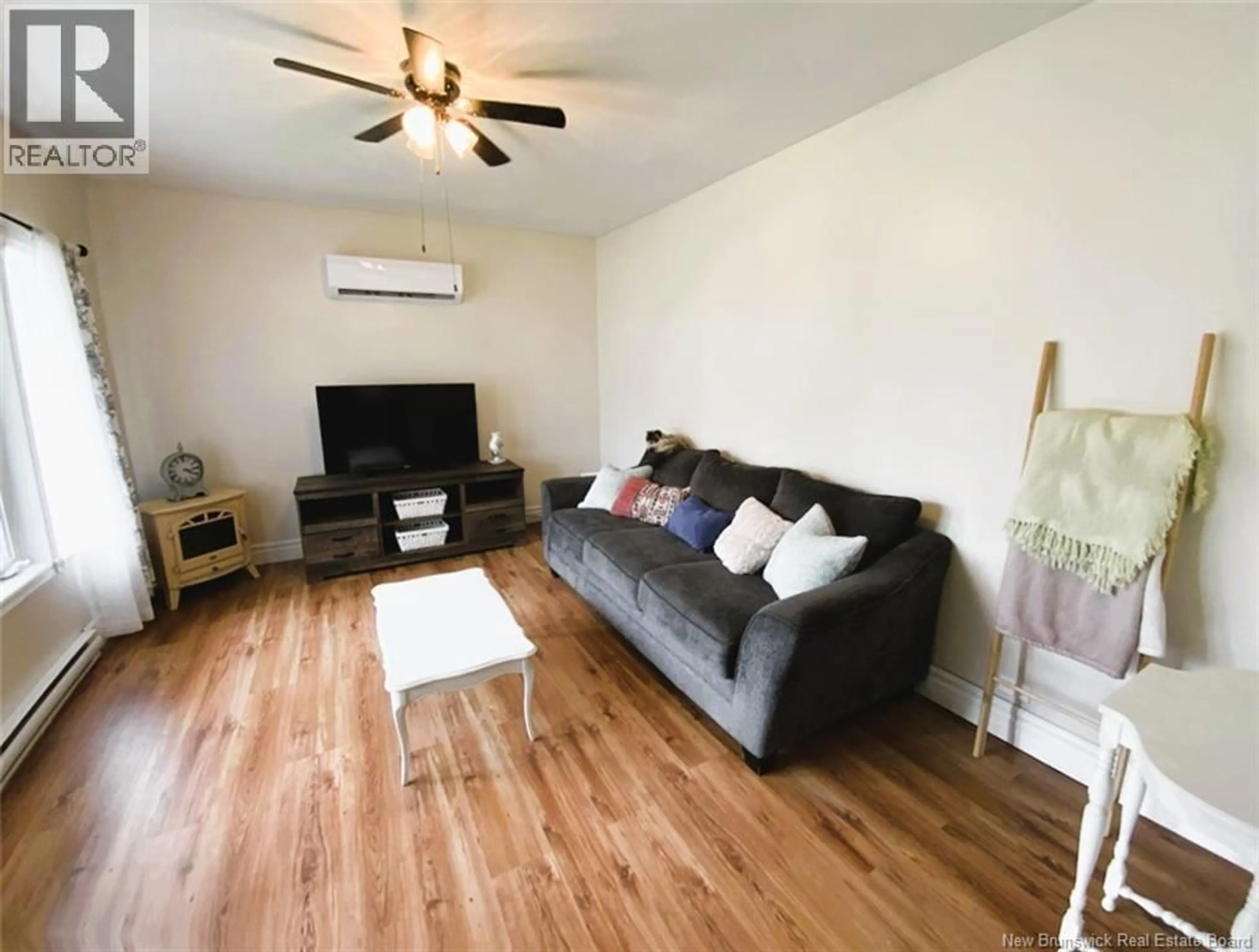 Living room with furniture, wood/laminate floor for 862 ST-FRANÇOIS STREET, Edmundston New Brunswick E3V4R2