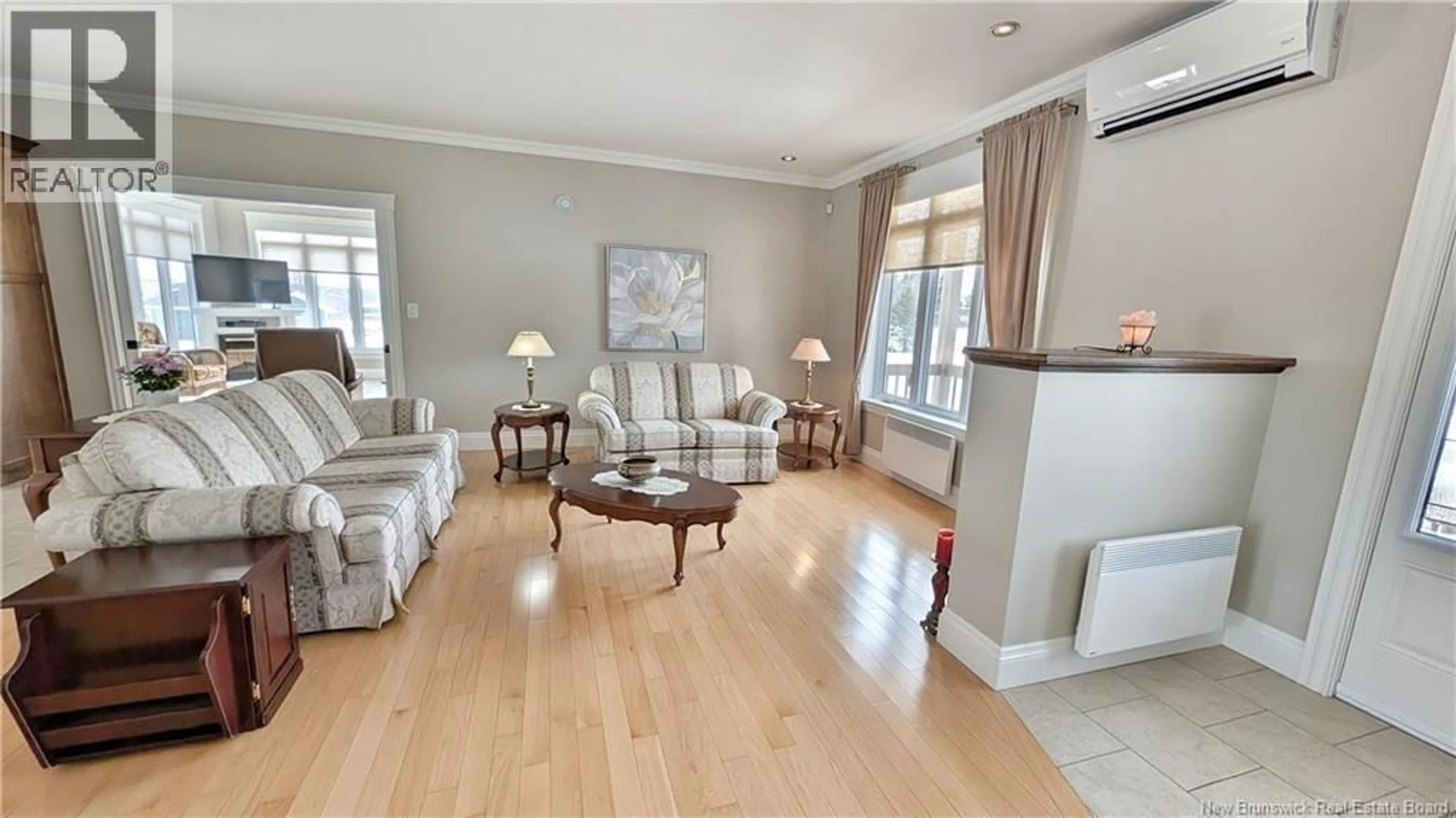 Living room with furniture, wood/laminate floor for 3956 RUE LUCE, Tracadie New Brunswick E1X1B6