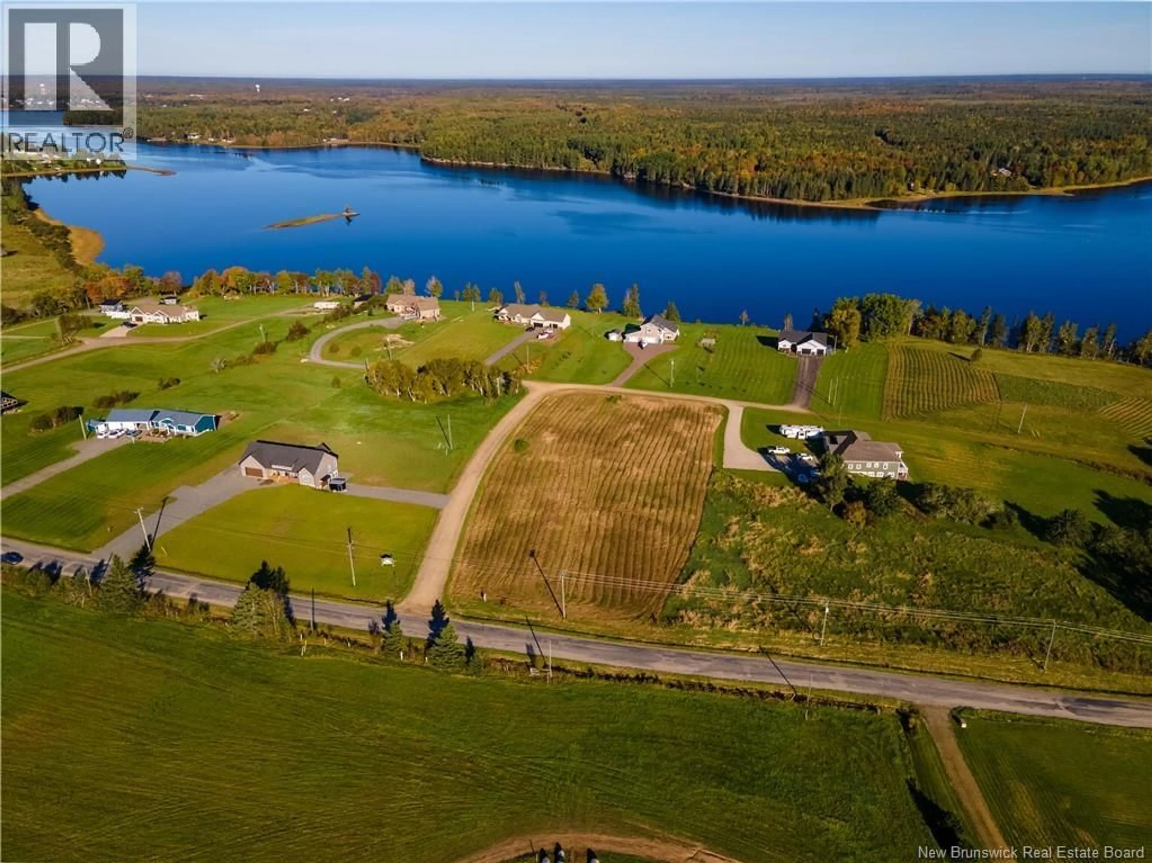 A pic from outside/outdoor area/front of a property/back of a property/a pic from drone, water/lake/river/ocean view for 20 ISLANDVIEW LANE, Main River New Brunswick E4T0B1