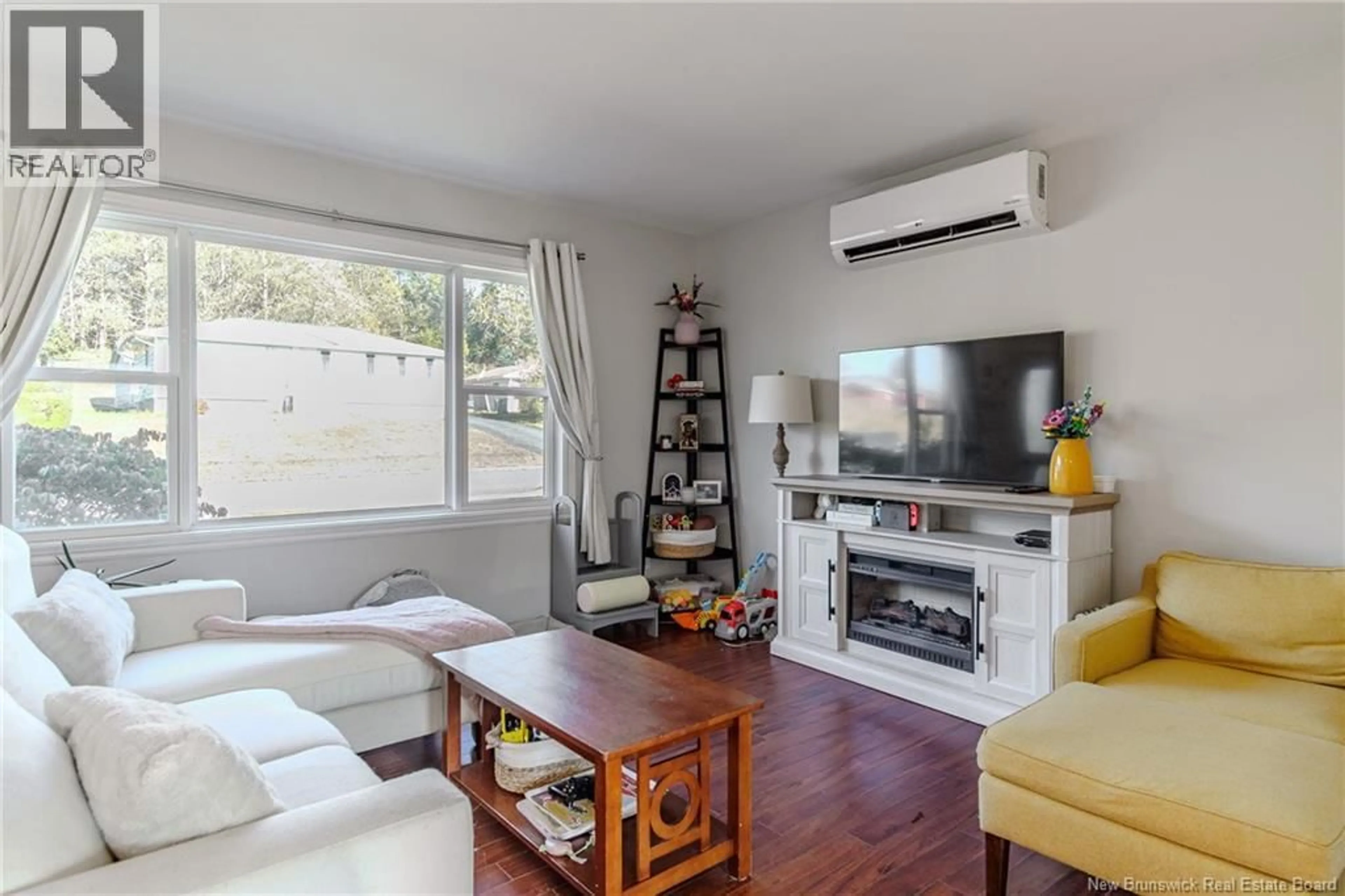 Living room with furniture, wood/laminate floor for 11 BRAEMAR DRIVE, Saint John New Brunswick E2J2T5