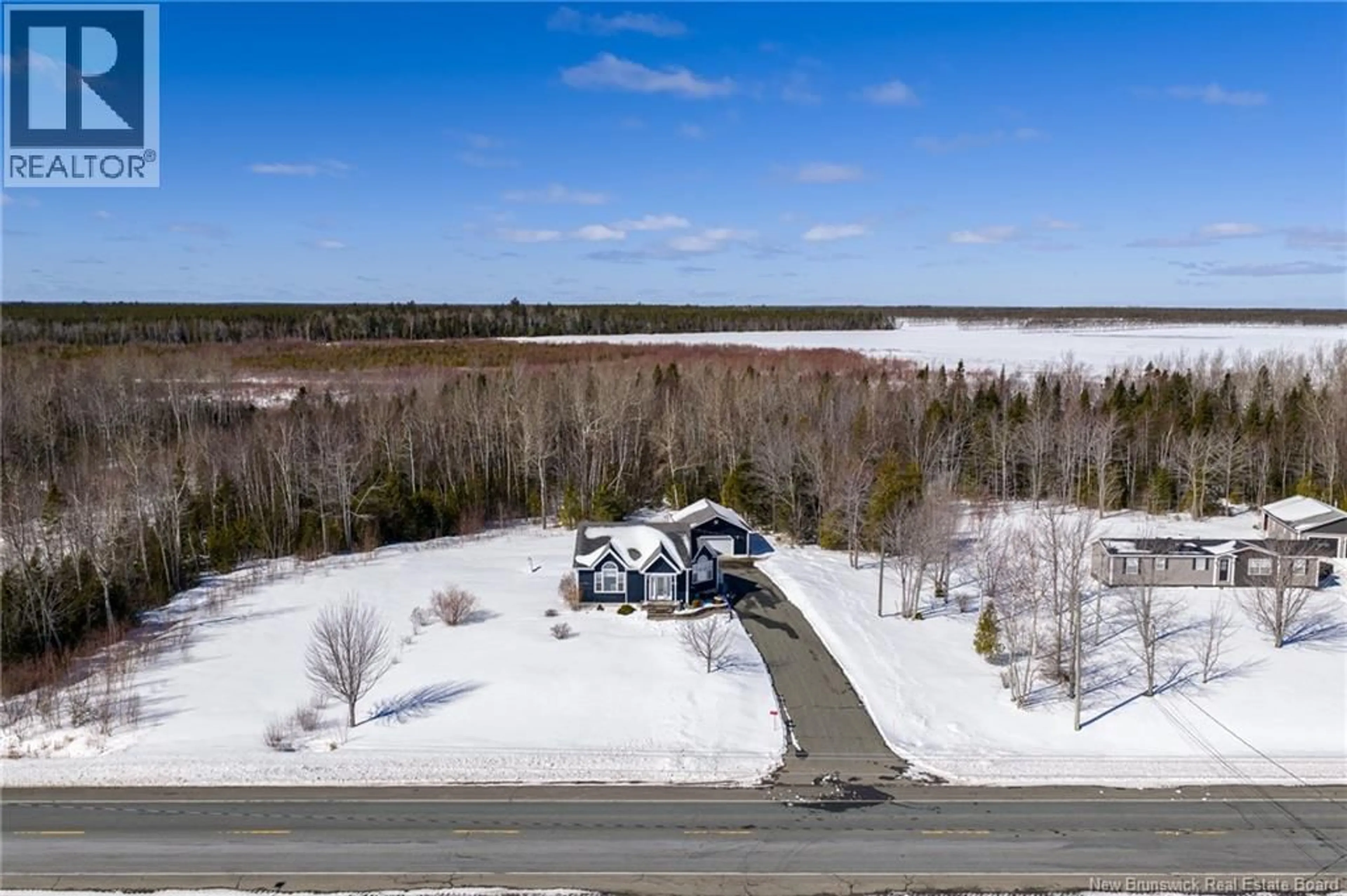 A pic from outside/outdoor area/front of a property/back of a property/a pic from drone, water/lake/river/ocean view for 4867 ROUTE 11, Brantville New Brunswick E9H1M3