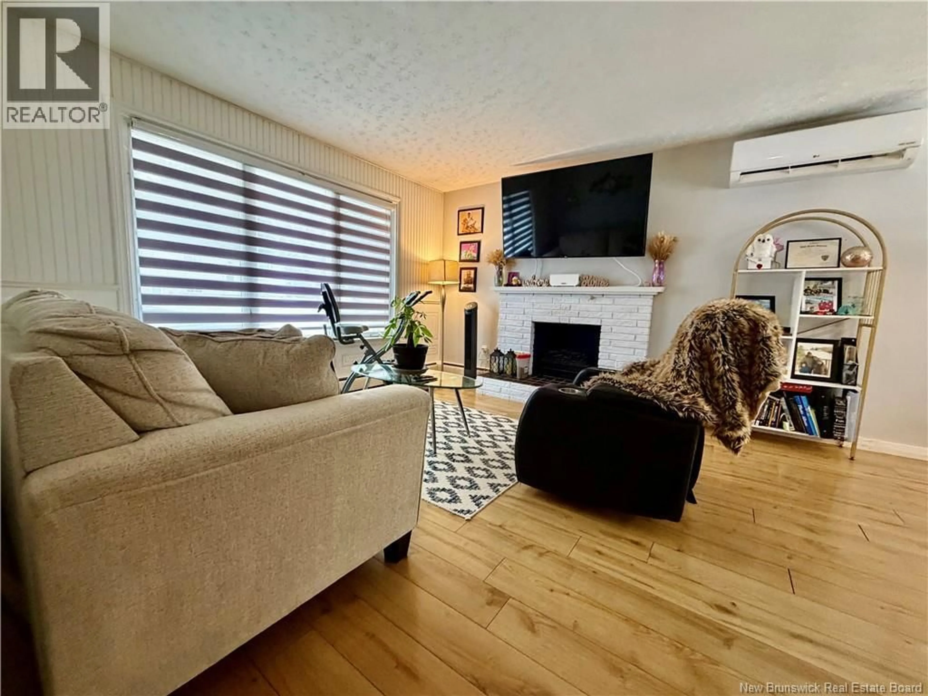 Living room with furniture, wood/laminate floor for 65 RANKINE STREET, Fredericton New Brunswick E3B4S2