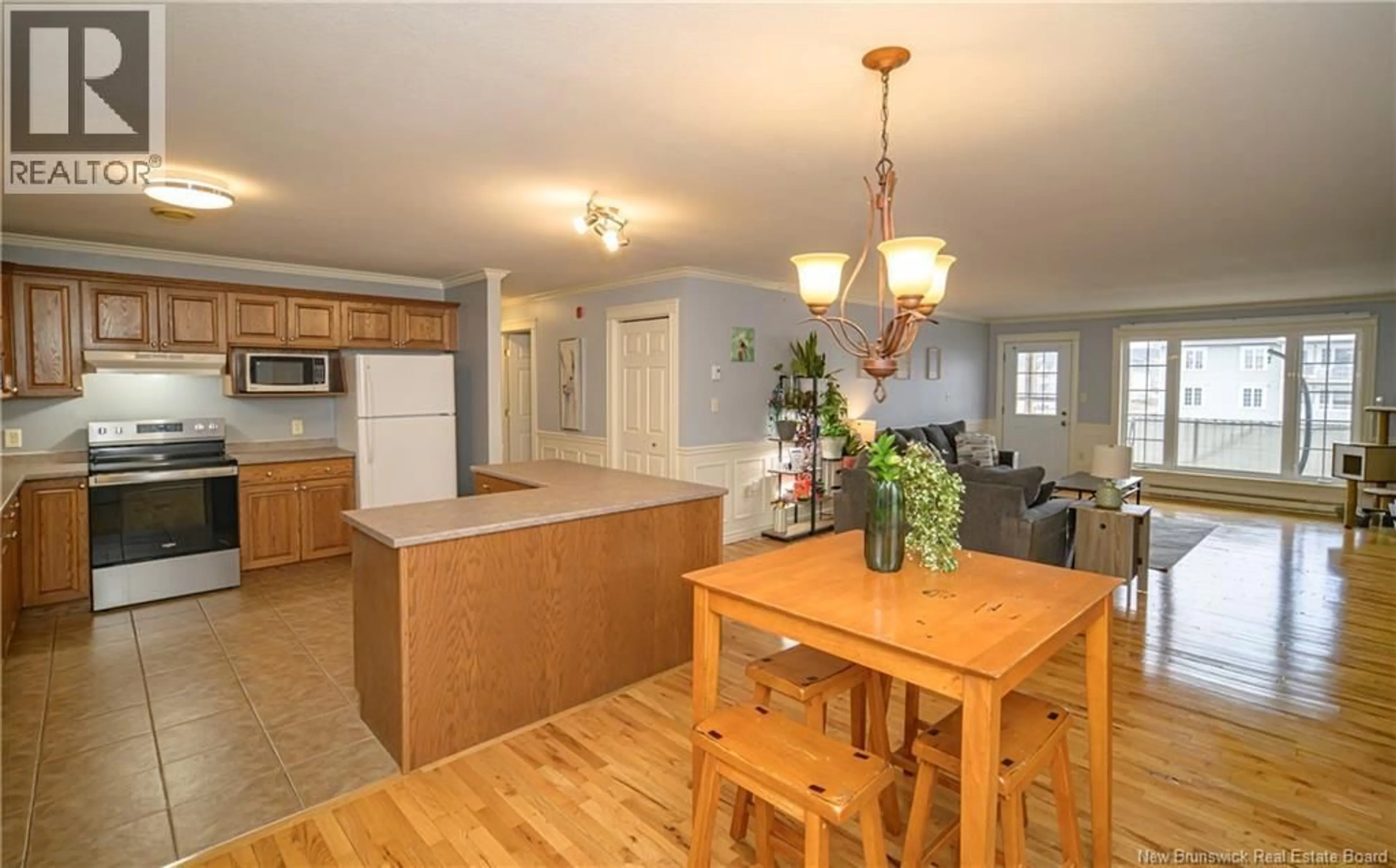 Open concept kitchen, wood/laminate floor for 56 - 51 LIAN STREET, Fredericton New Brunswick E3C0A2