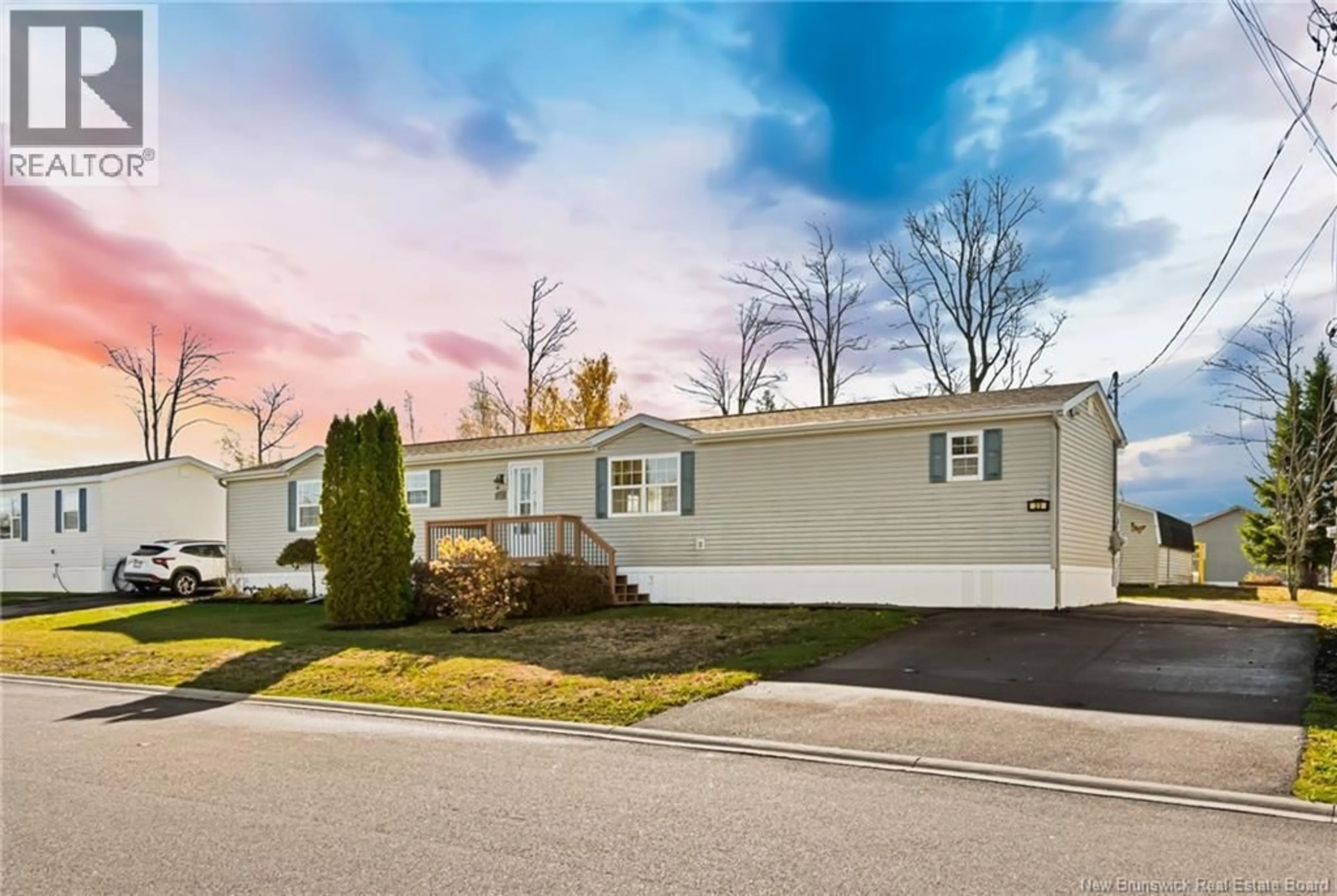 Home with vinyl exterior material, street for 23 RICHIBUCTOU LANE, Dieppe New Brunswick E1A7N1