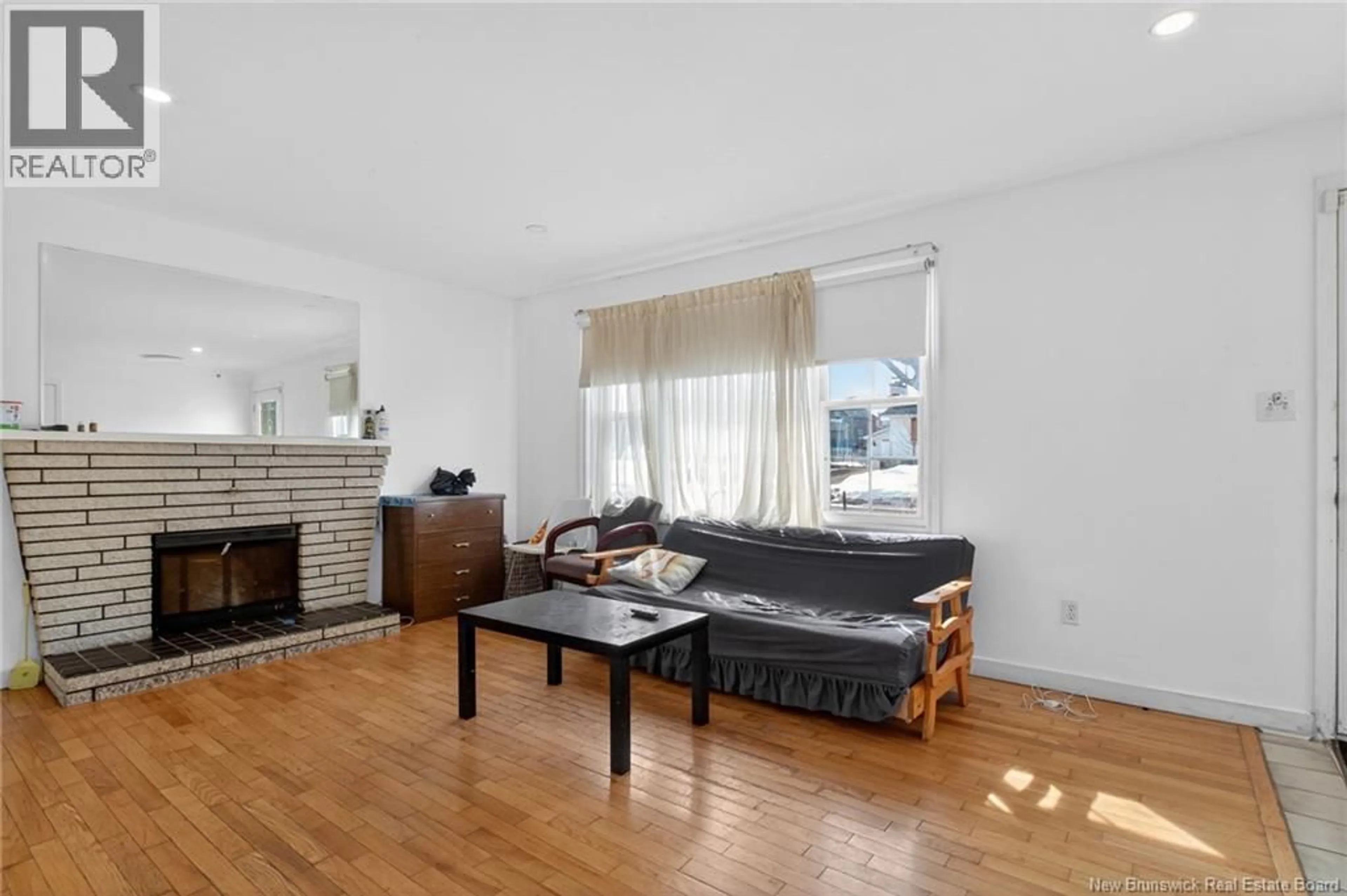 Living room with furniture, wood/laminate floor for 27 MILLER DRIVE, Moncton New Brunswick E1C7T3