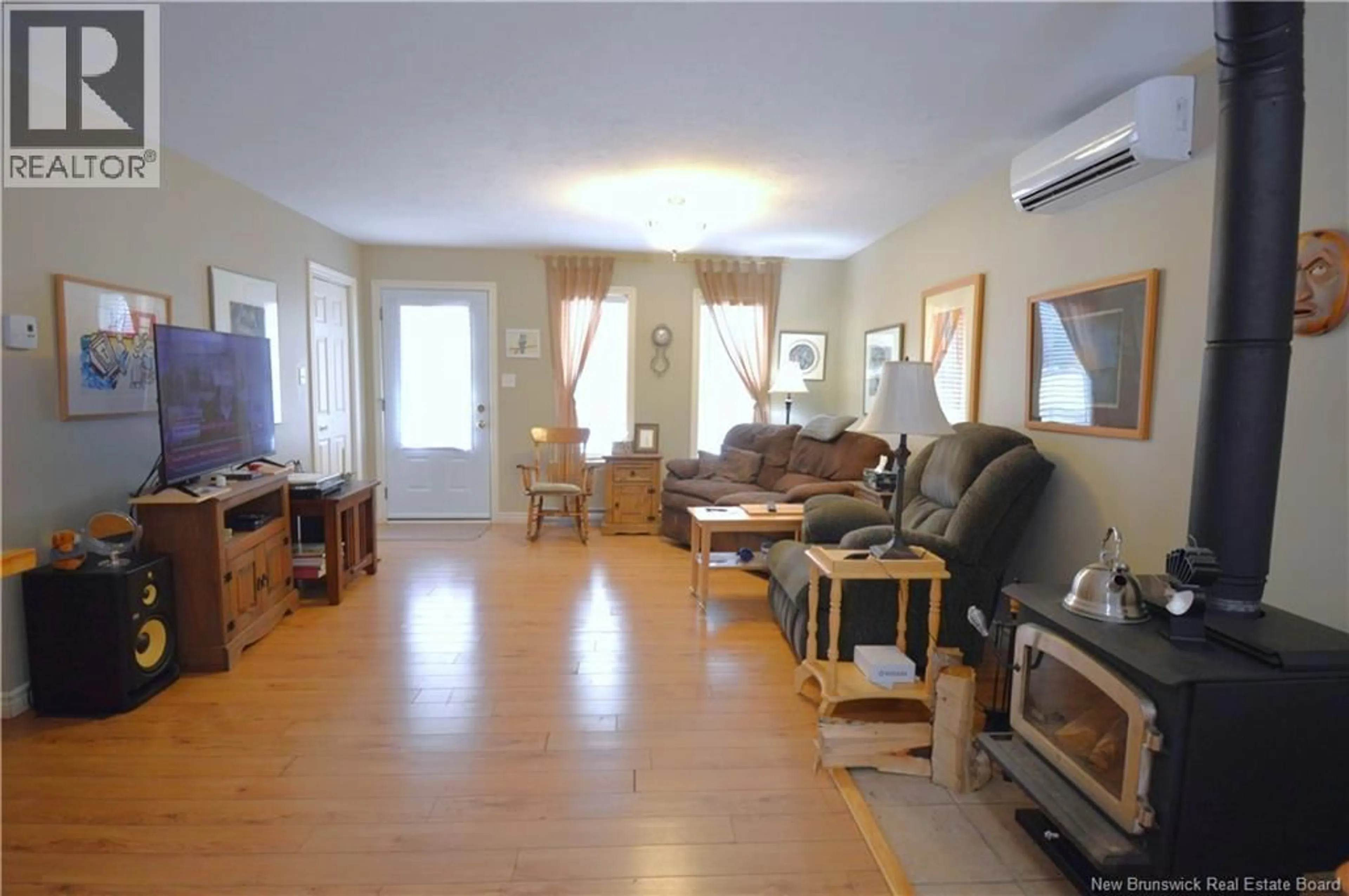 Living room with furniture, wood/laminate floor for 401 SAINT-ANDRE ROAD, Cap-Pelé New Brunswick E4N1Z5