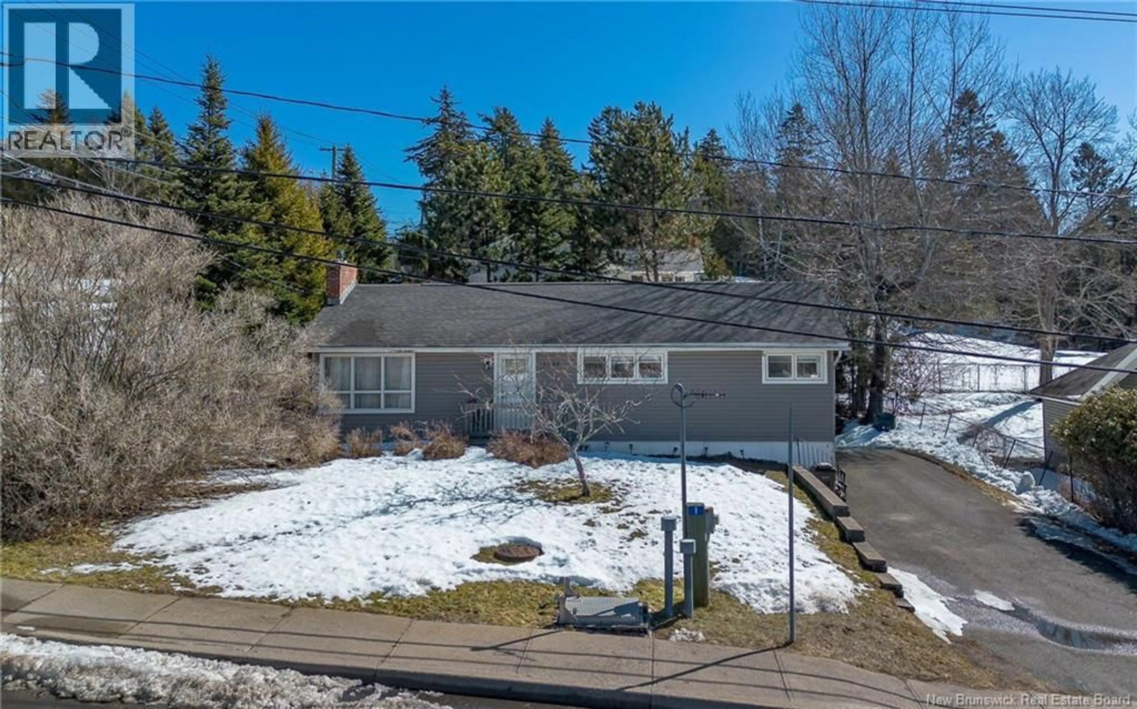 A pic from outside/outdoor area/front of a property/back of a property/a pic from drone, street for 1240 KENNEBECASIS DRIVE, Saint John New Brunswick E2K5B1