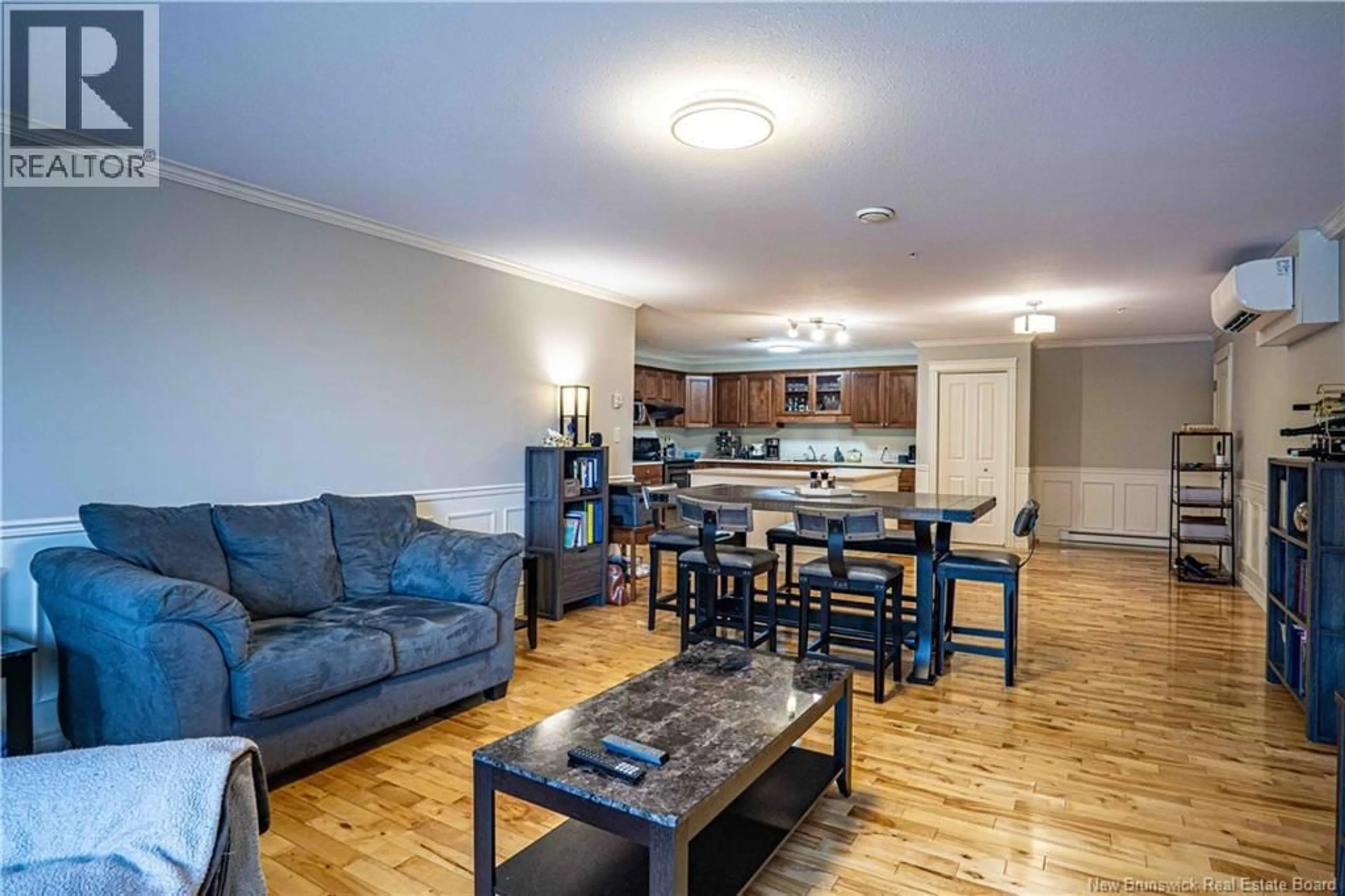 Living room with furniture, wood/laminate floor for 213 - 225 SERENITY LANE, Fredericton New Brunswick E3B0H1