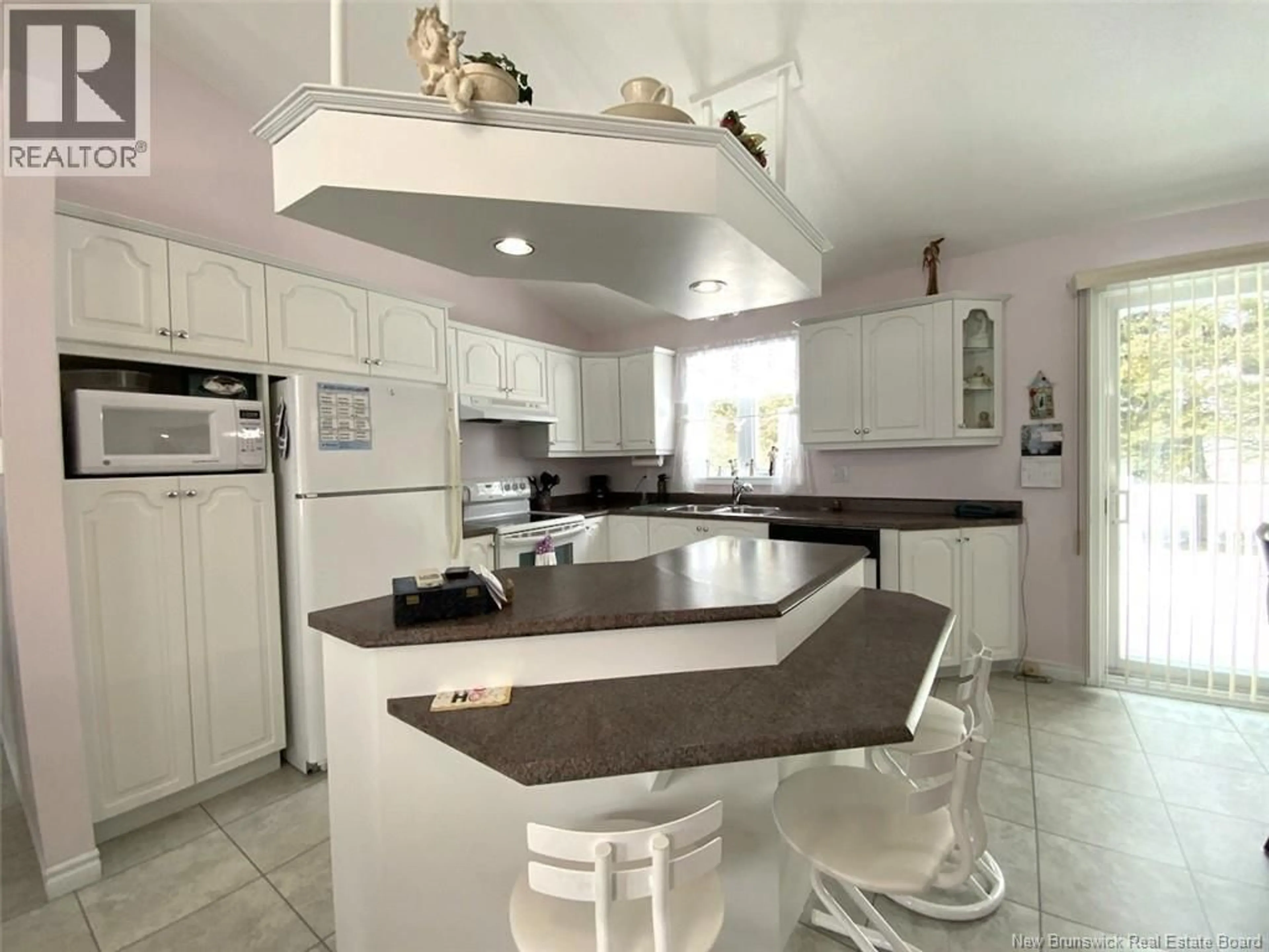 Open concept kitchen, ceramic/tile floor for 32 MGR. DIONNE AVENUE, Edmundston New Brunswick E3V4Y7
