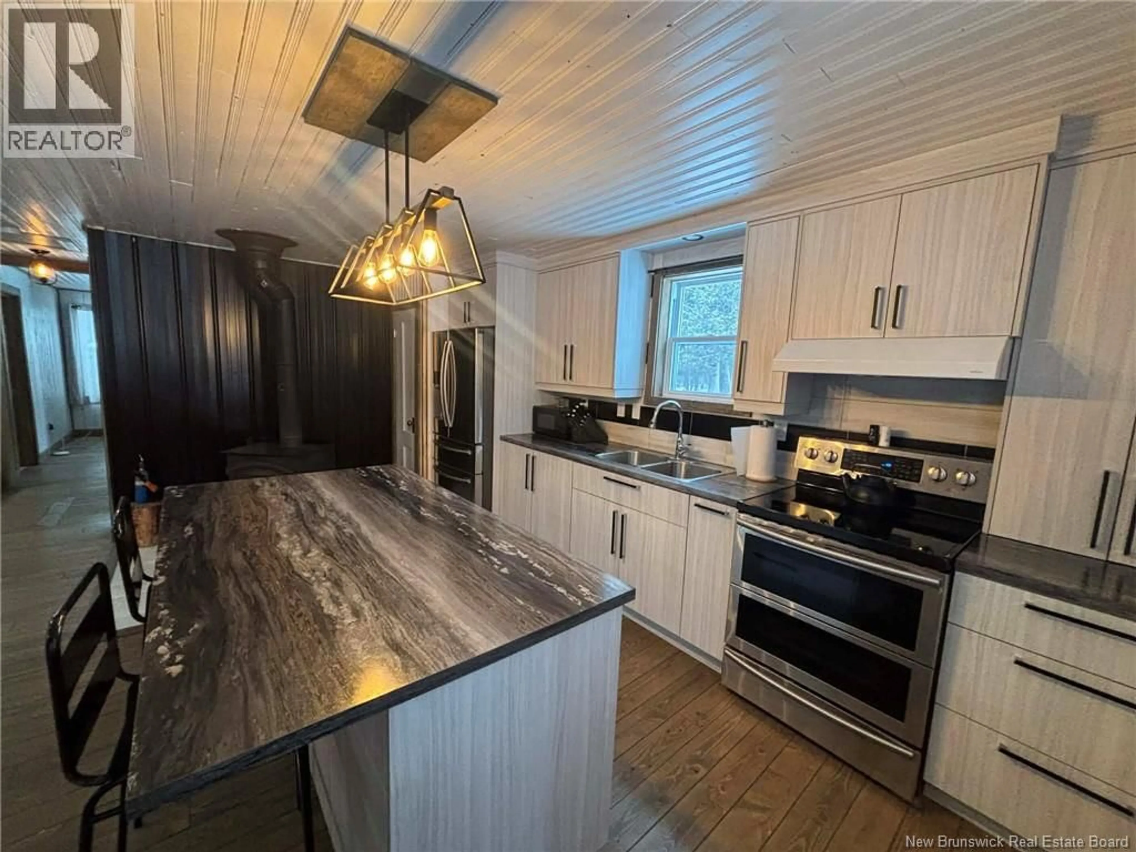 Open concept kitchen, wood/laminate floor for 192 RANG 5&6 RD, Saint-Quentin New Brunswick E8A2G1