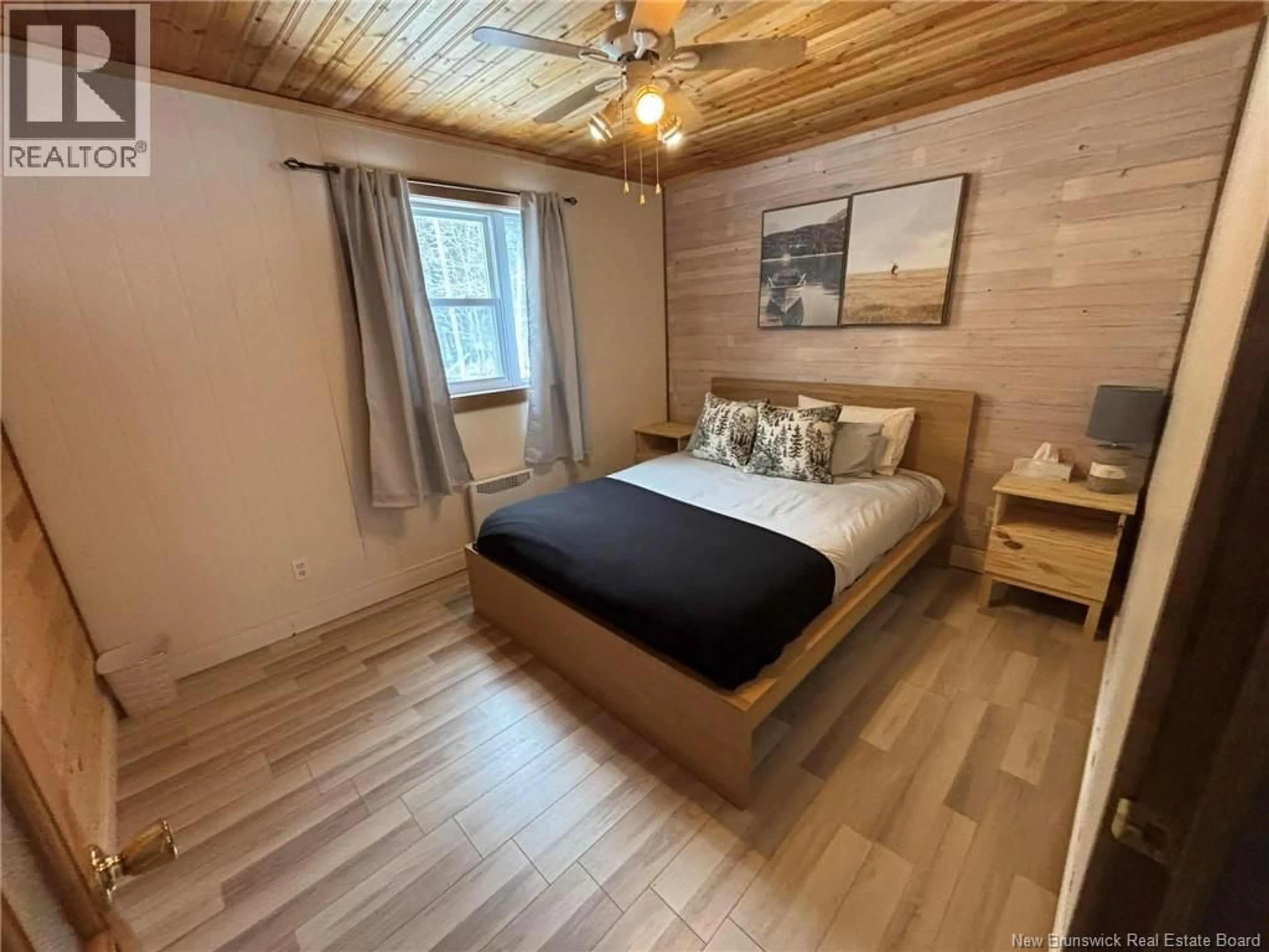 Bedroom with bed, wood/laminate floor for 192 RANG 5&6 RD, Saint-Quentin New Brunswick E8A2G1