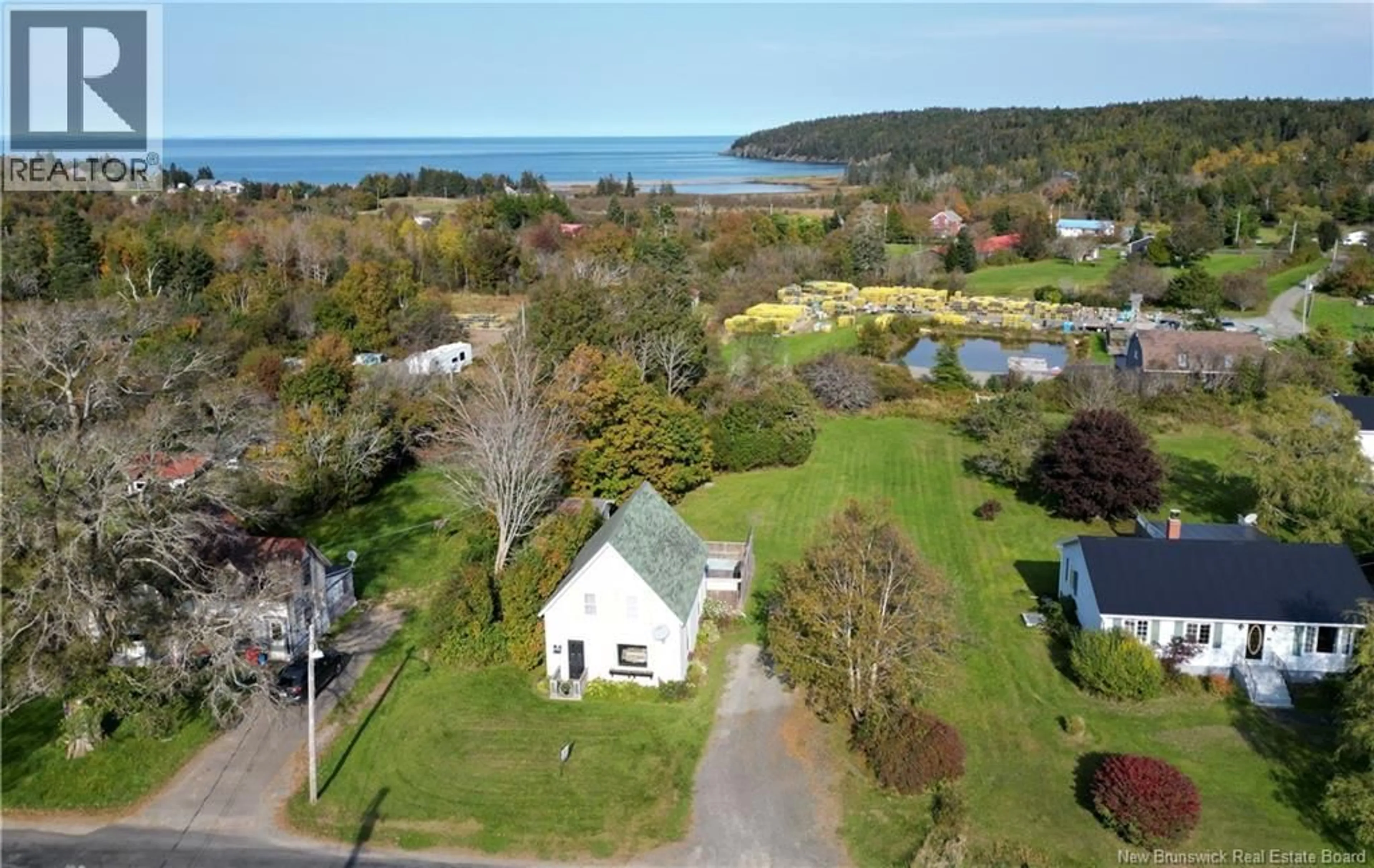 A pic from outside/outdoor area/front of a property/back of a property/a pic from drone, water/lake/river/ocean view for 16 WHISTLE ROAD, Grand Manan New Brunswick E5G1B1