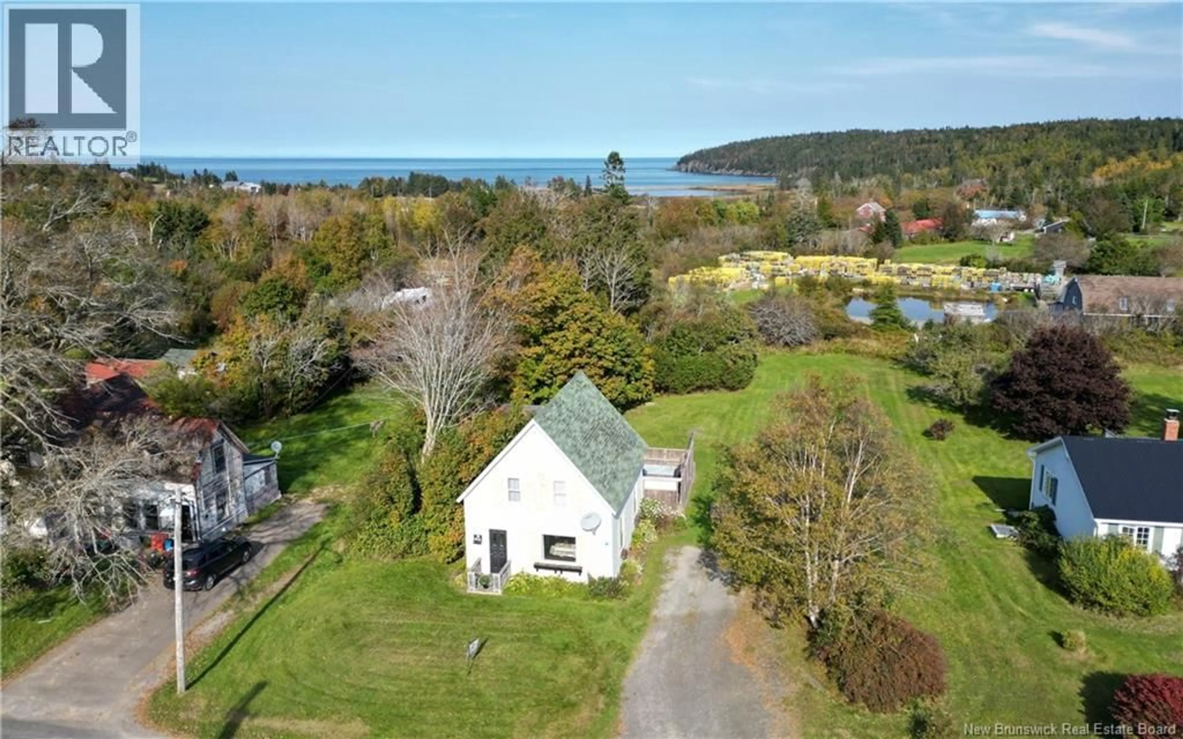 A pic from outside/outdoor area/front of a property/back of a property/a pic from drone, water/lake/river/ocean view for 16 WHISTLE ROAD, Grand Manan New Brunswick E5G1B1