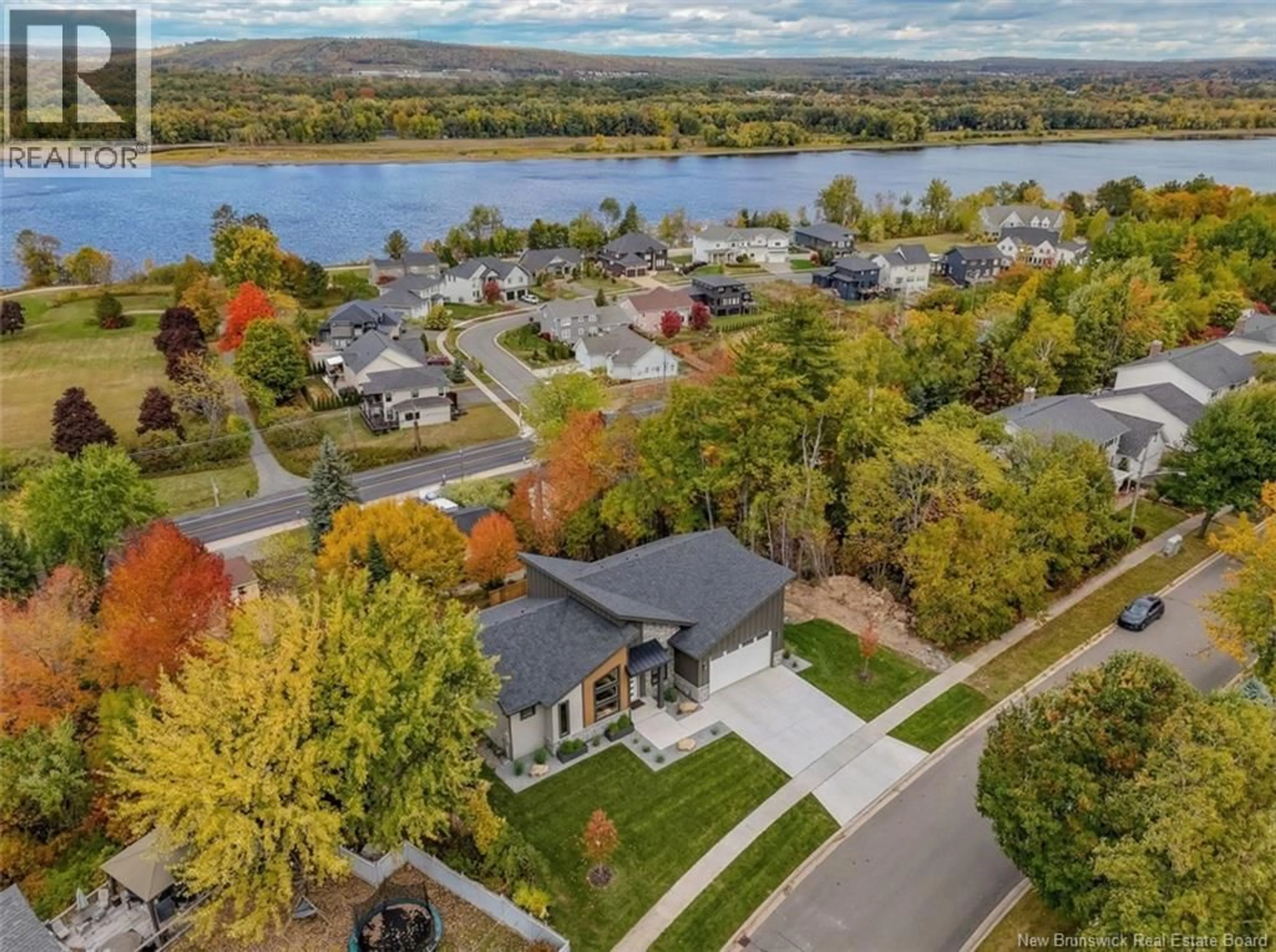 A pic from outside/outdoor area/front of a property/back of a property/a pic from drone, water/lake/river/ocean view for 53 KINGSWOOD DRIVE, Fredericton New Brunswick E3B6Z8