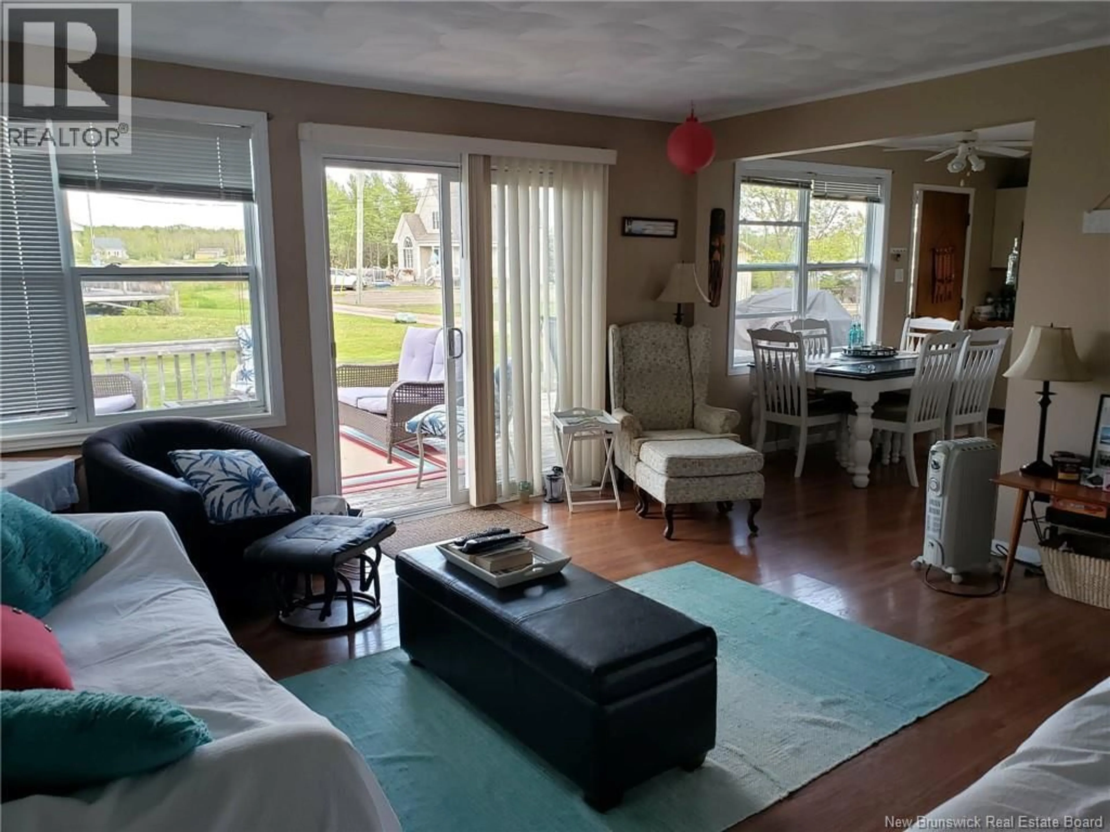 Living room with furniture, wood/laminate floor for 12 ALLISON LANE, Pointe-Du-Chêne New Brunswick E4P5K7