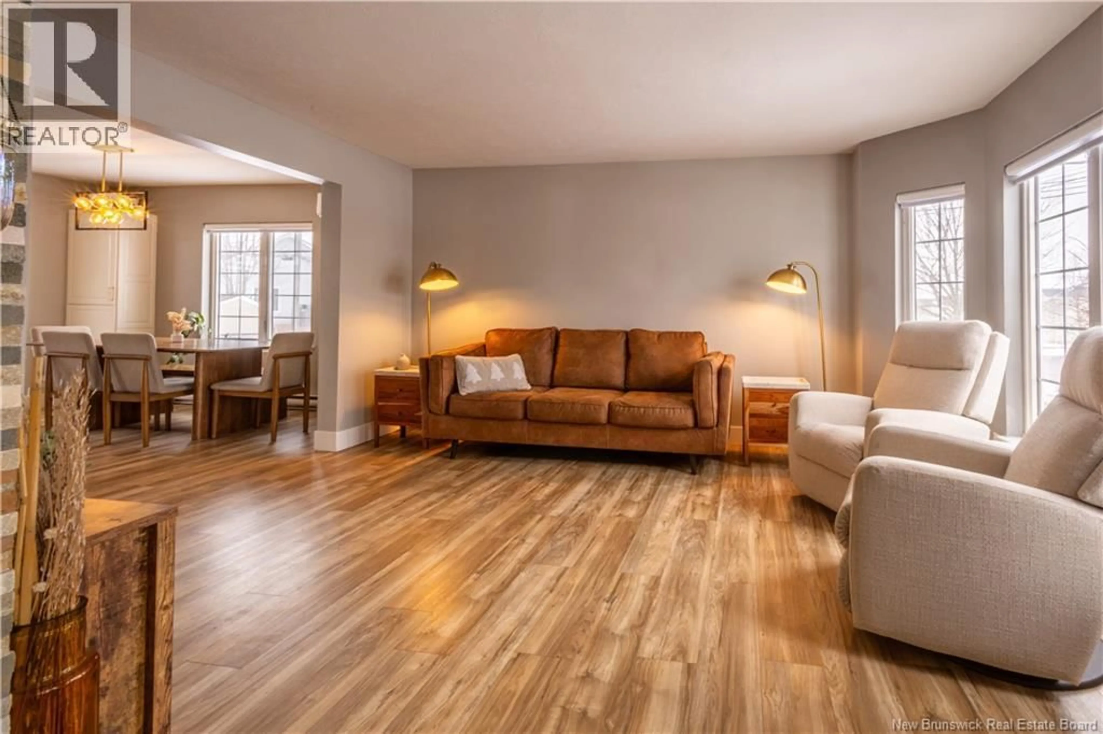 Living room with furniture, wood/laminate floor for 239 RENNICK ROAD, Moncton New Brunswick E1G4X9
