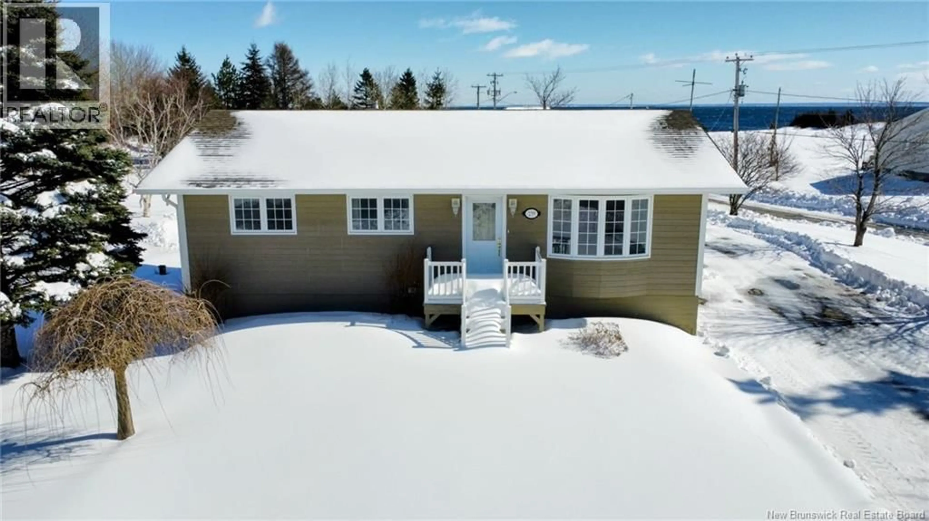 A pic from outside/outdoor area/front of a property/back of a property/a pic from drone, water/lake/river/ocean view for 239 PRINCIPALE, Nigadoo New Brunswick E8K3S8