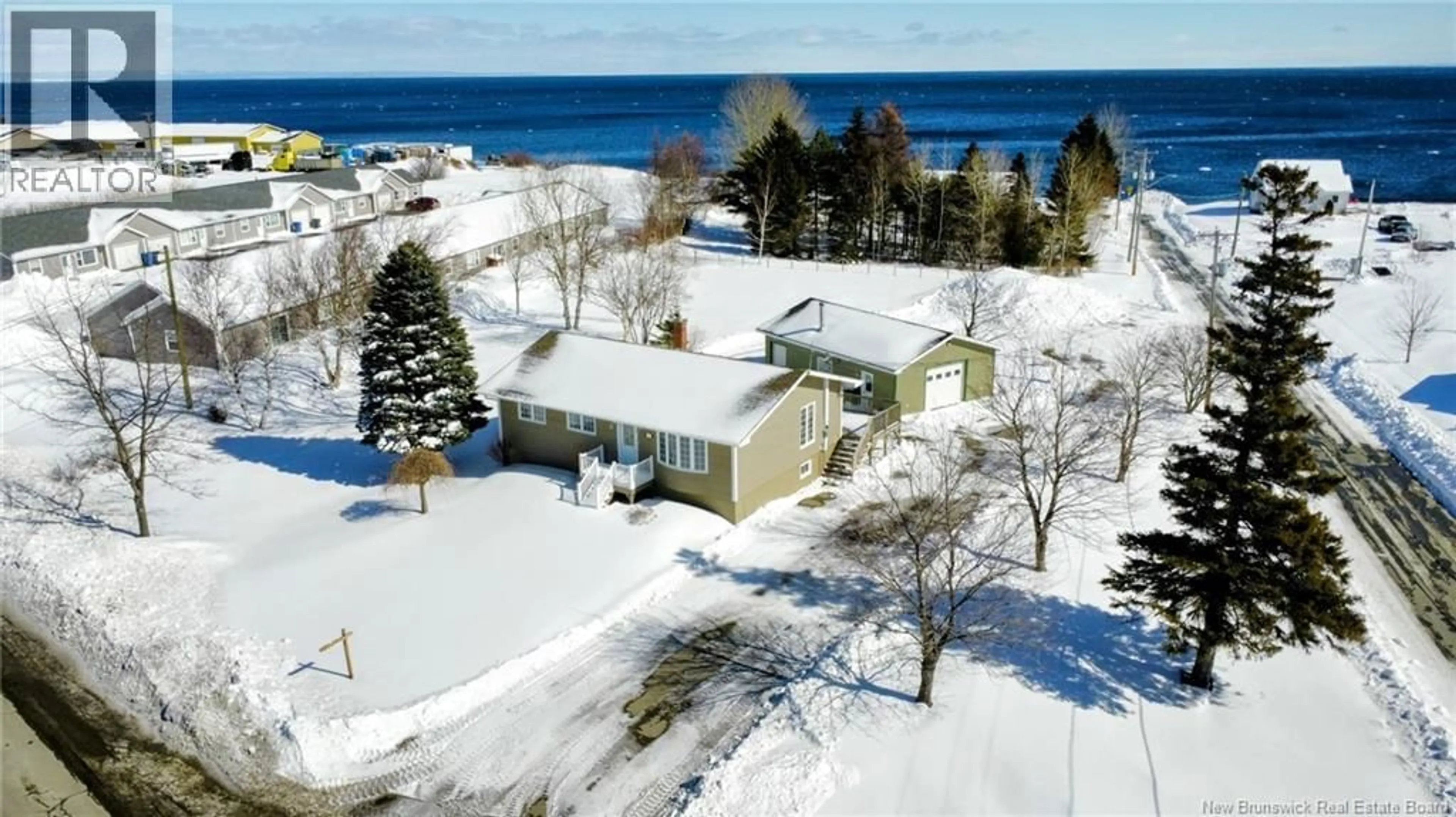 A pic from outside/outdoor area/front of a property/back of a property/a pic from drone, water/lake/river/ocean view for 239 PRINCIPALE, Nigadoo New Brunswick E8K3S8