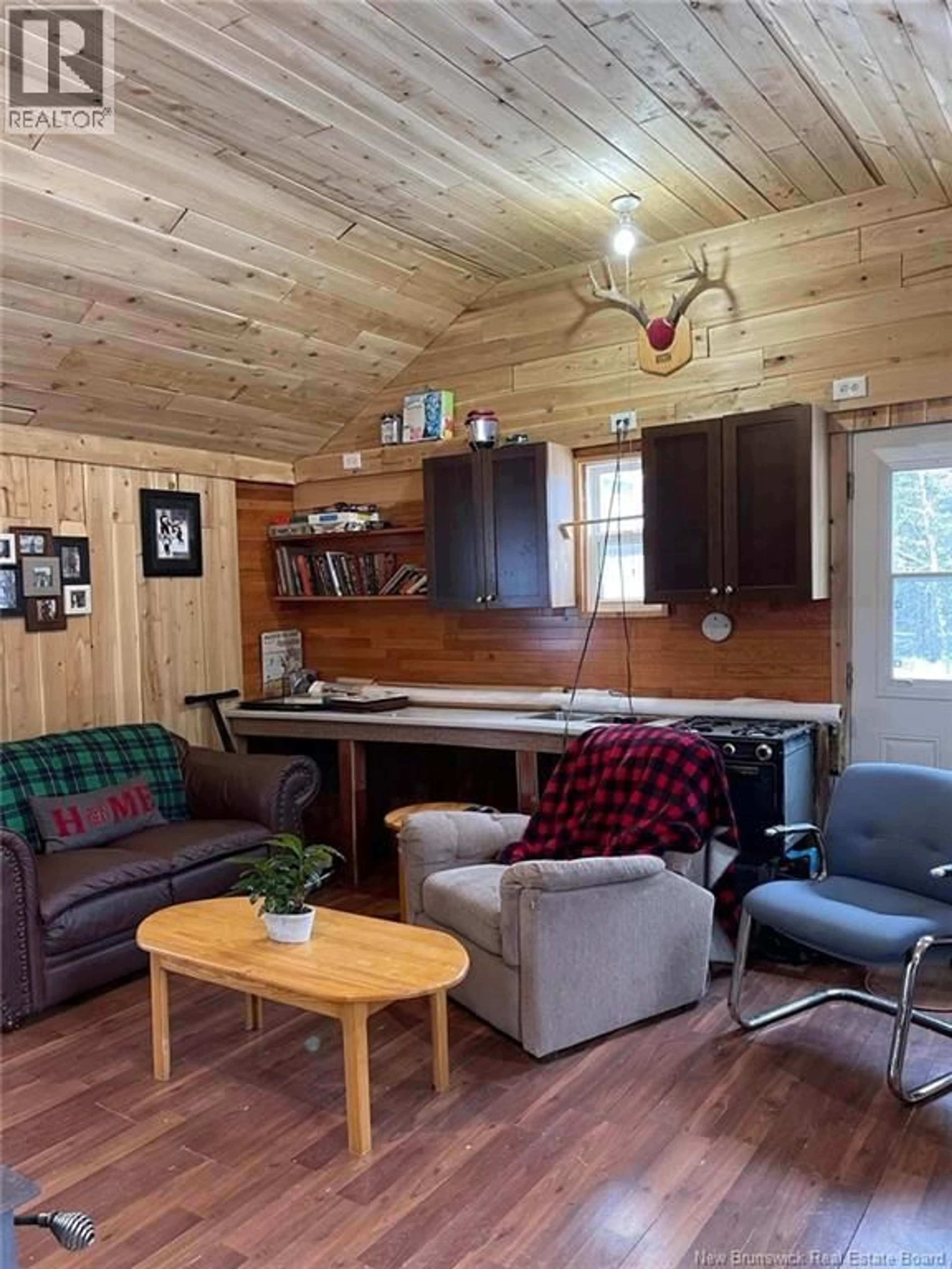 Living room with furniture, wood/laminate floor for 211 CAMPBELL SETTLEMENT ROAD, Rossville New Brunswick E6G1Z2