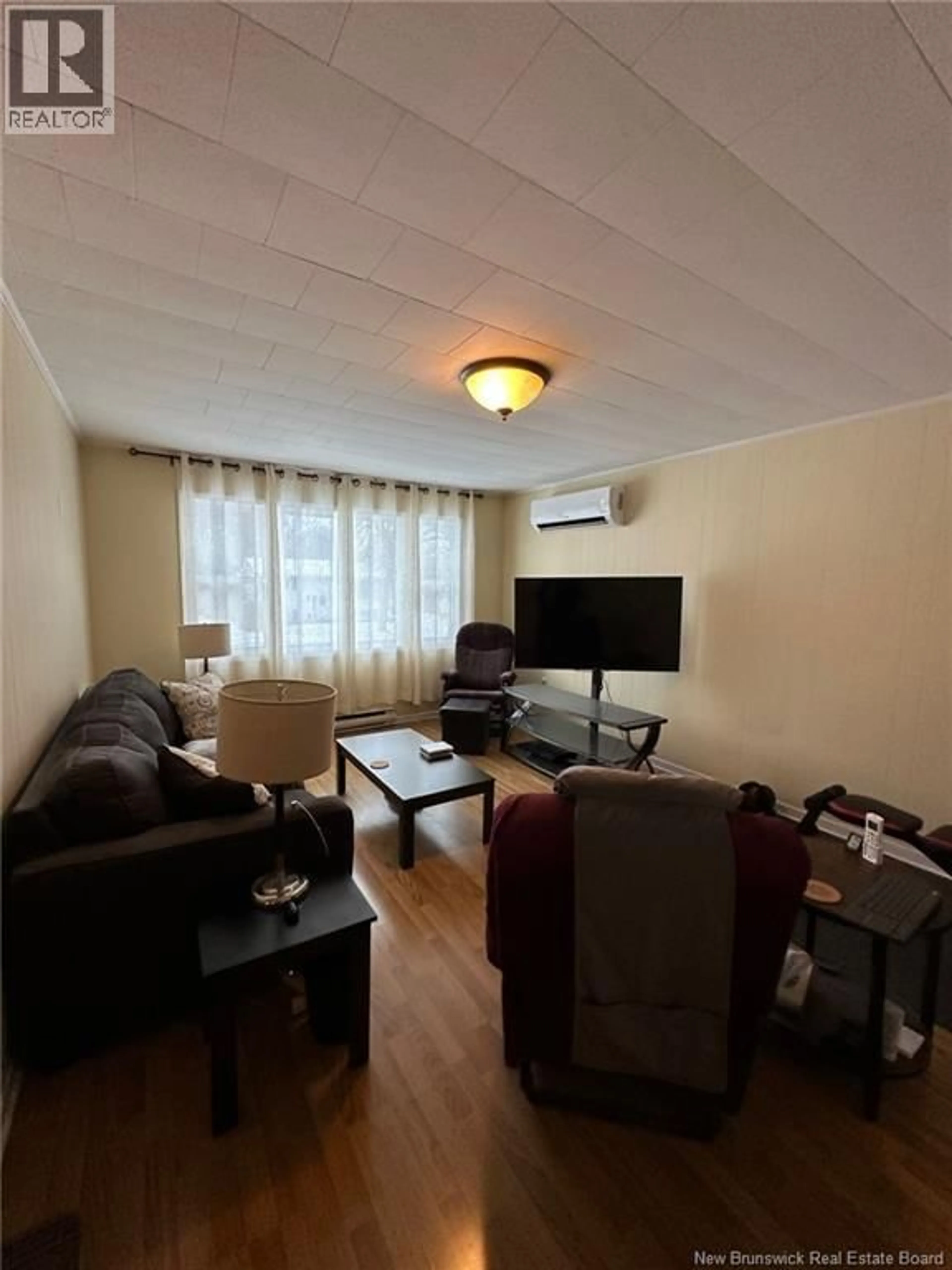 Living room with furniture, wood/laminate floor for 40 1/2 - 40 HURON AVENUE, Fredericton New Brunswick E3A1J7