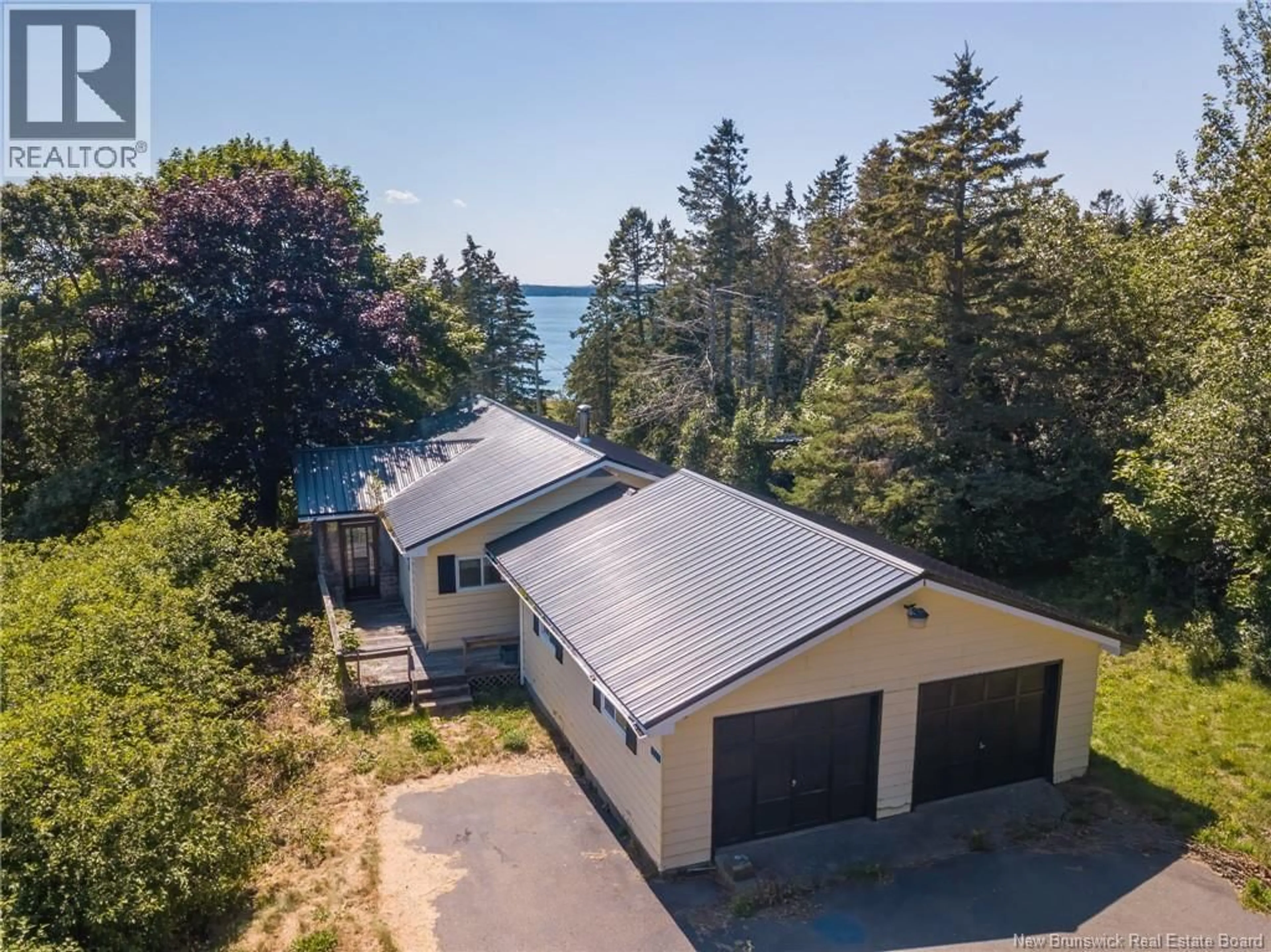 A pic from outside/outdoor area/front of a property/back of a property/a pic from drone, water/lake/river/ocean view for 2561 ROUTE 774, Wilsons Beach New Brunswick E5E1J8