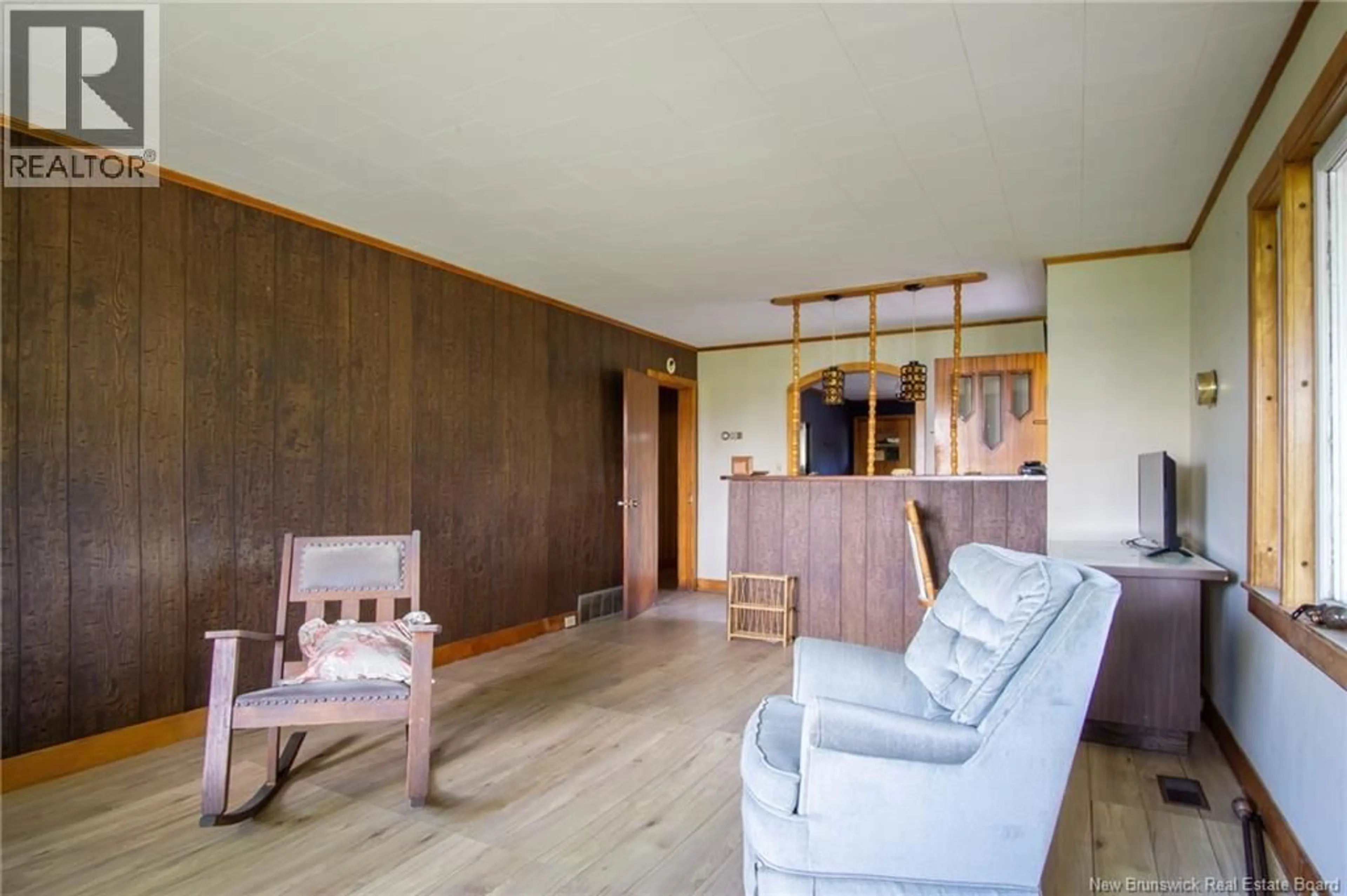 Living room with furniture, wood/laminate floor for 2561 ROUTE 774, Wilsons Beach New Brunswick E5E1J8