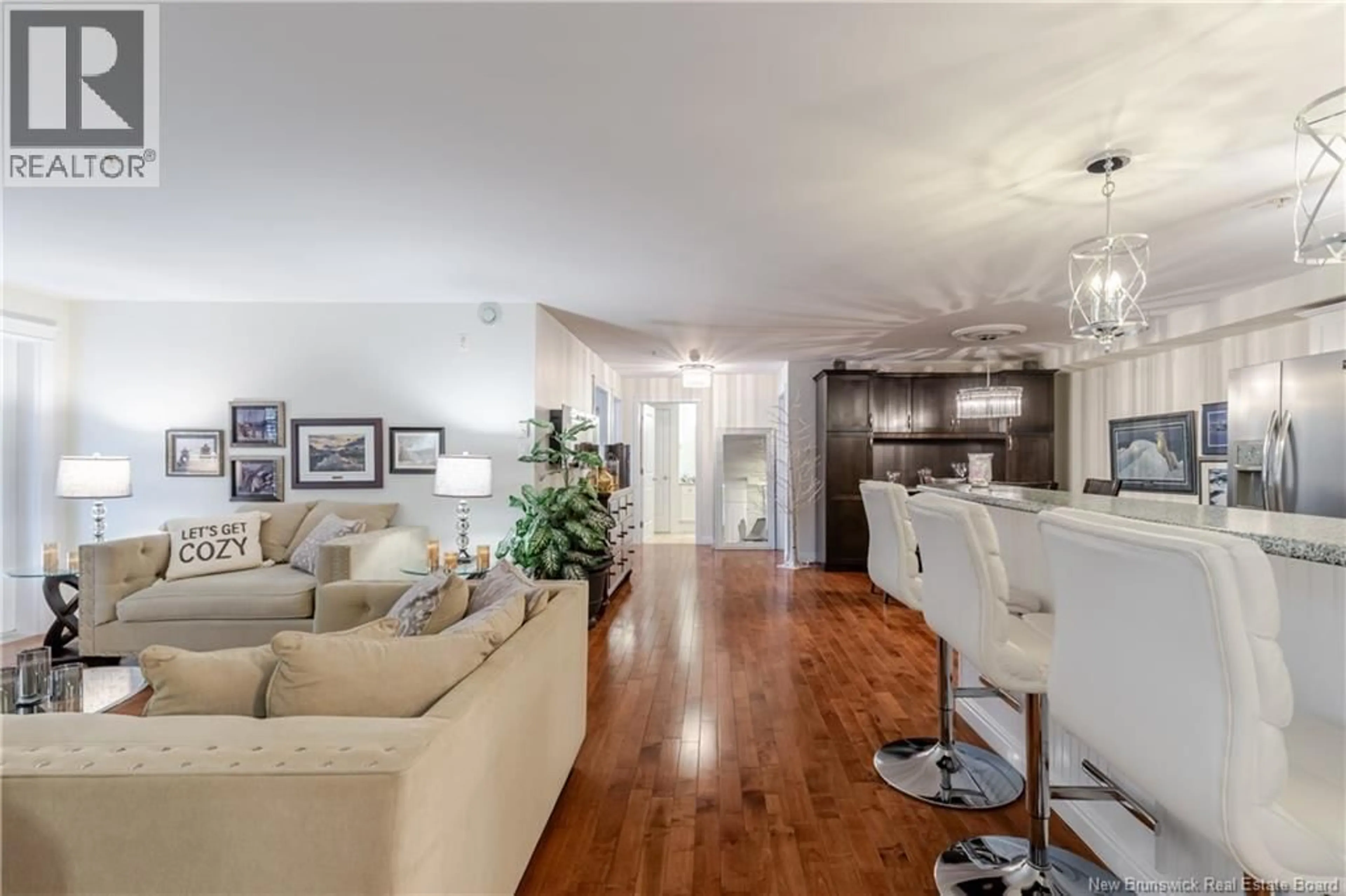 Living room with furniture, wood/laminate floor for 209 - 700 CLIFFE STREET, Fredericton New Brunswick E3A5V2