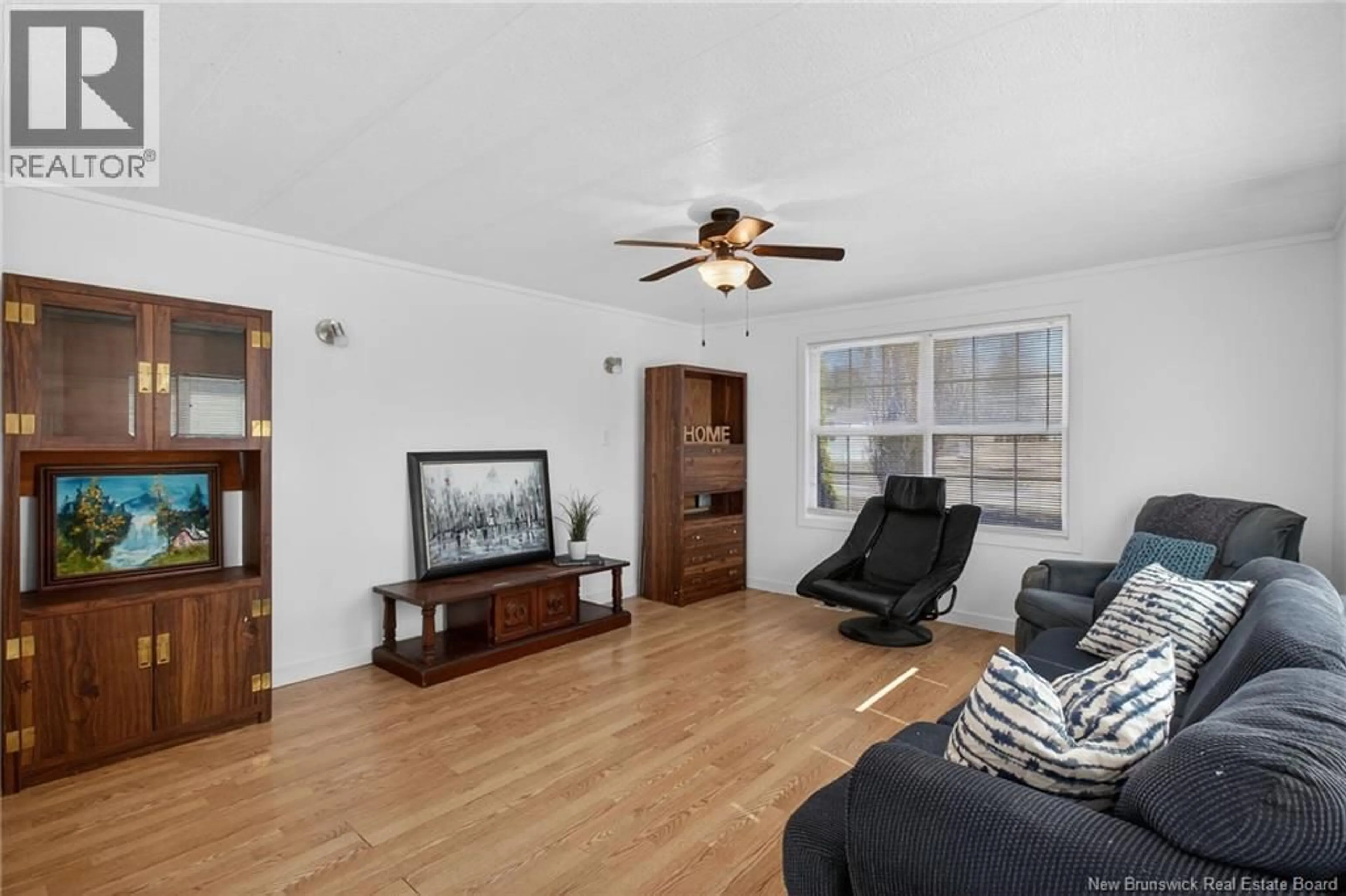 Living room with furniture, wood/laminate floor for 84 BIDDINGTON, Moncton New Brunswick E1H1C3