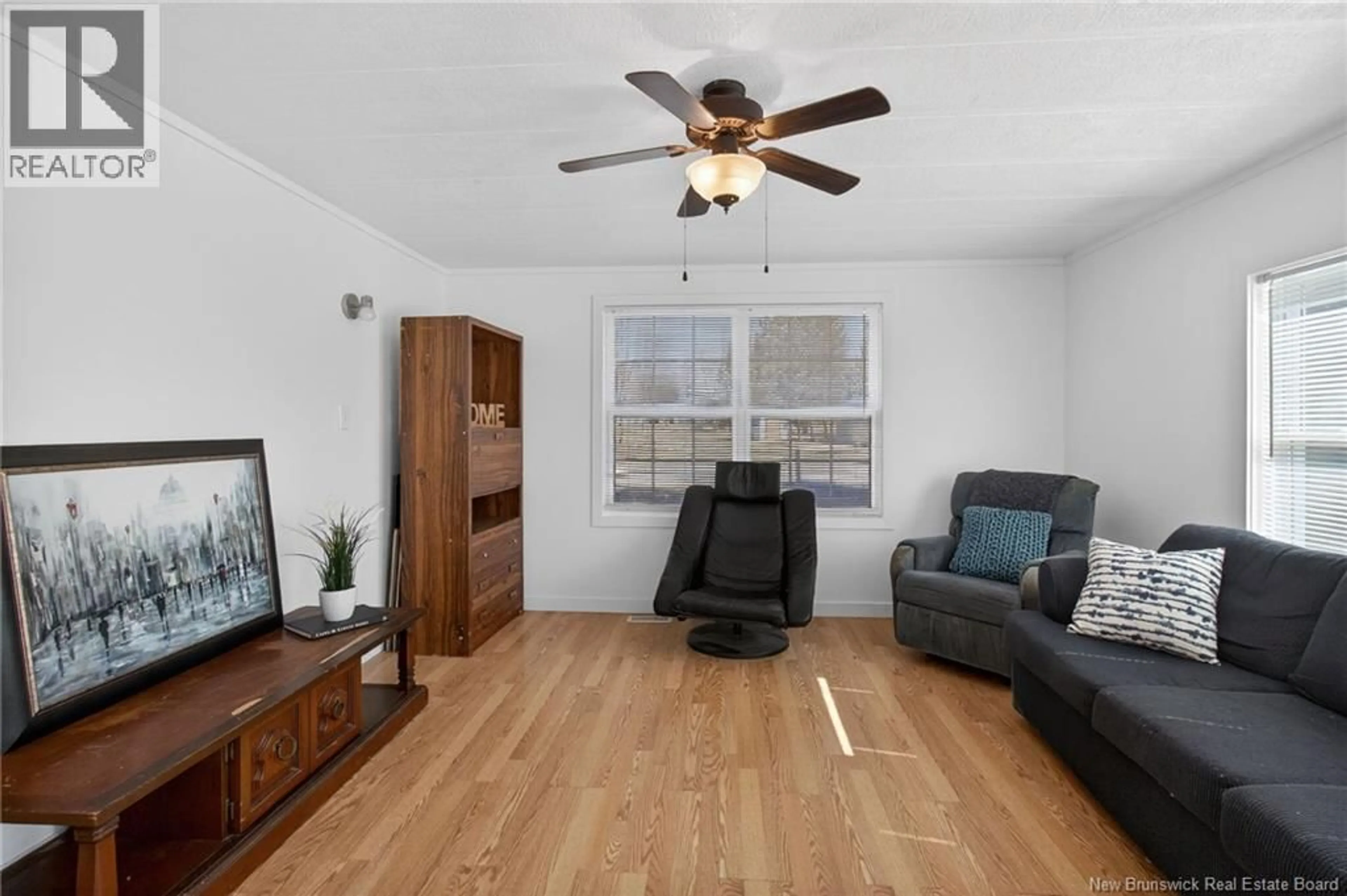 Living room with furniture, wood/laminate floor for 84 BIDDINGTON, Moncton New Brunswick E1H1C3