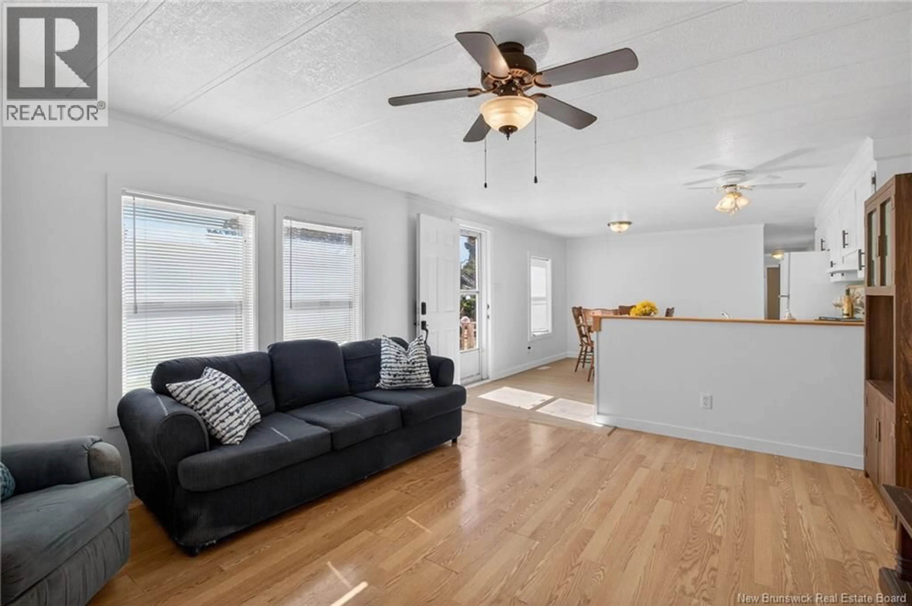 Living room with furniture, wood/laminate floor for 84 BIDDINGTON, Moncton New Brunswick E1H1C3