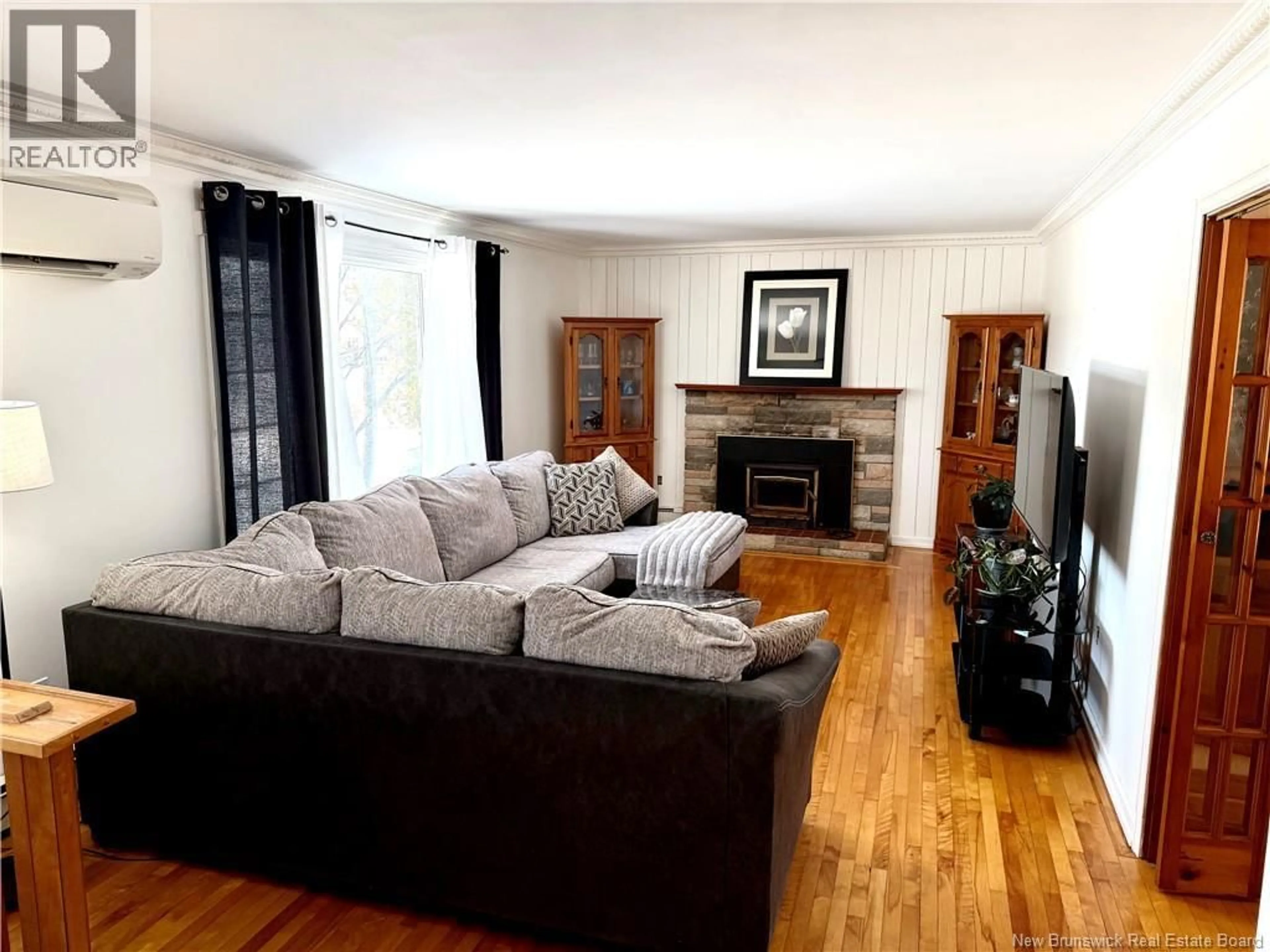 Living room with furniture, wood/laminate floor for 2737 LOCH LOMOND ROAD, Saint John New Brunswick E2J1M5