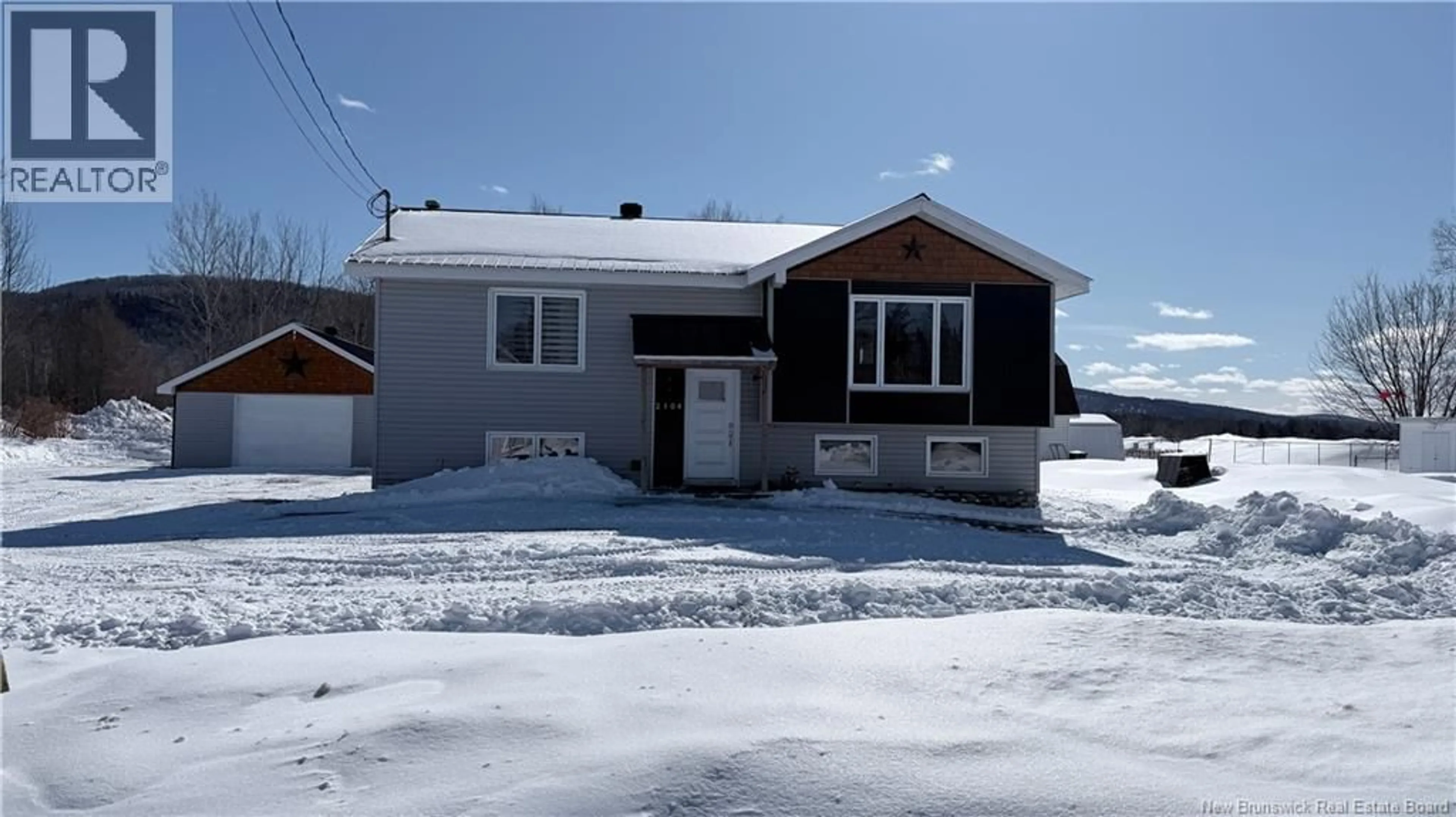 Home with vinyl exterior material, street for 2104 COMMERCIALE, Saint-François-de-Madawaska New Brunswick E7A1B4