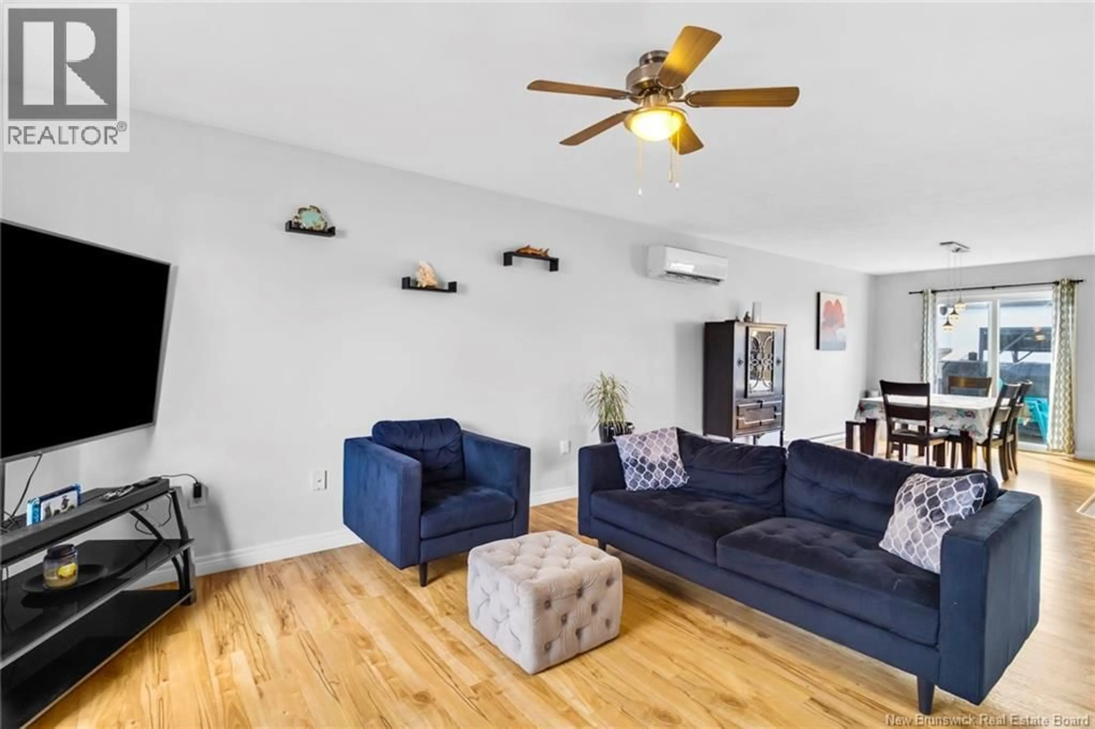 Living room with furniture, wood/laminate floor for 53 LANSDOWN AVENUE, Oromocto New Brunswick E2V4J7